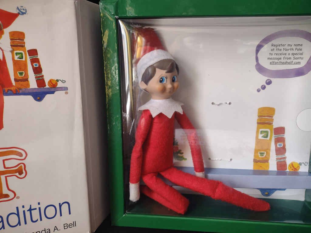 Set Books and Blue Eyes Brown Hair Elf and Naughty Nice Board Game (lot 1724)