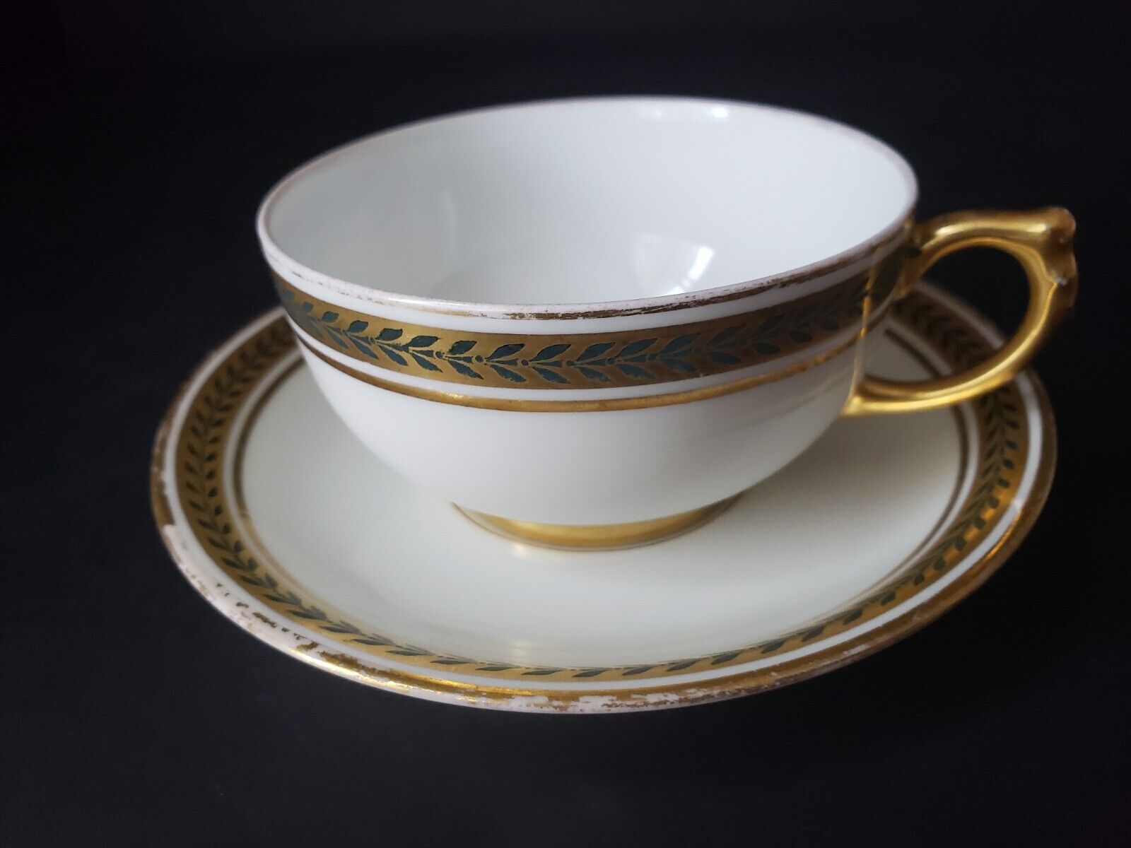 JP Limoges France Gold Trim Green Laurel Teacup & Saucer (lot 600)