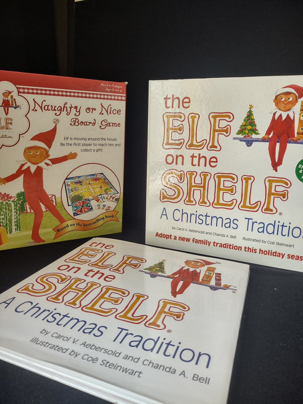 Set Books and Blue Eyes Brown Hair Elf and Naughty Nice Board Game (lot 1724)