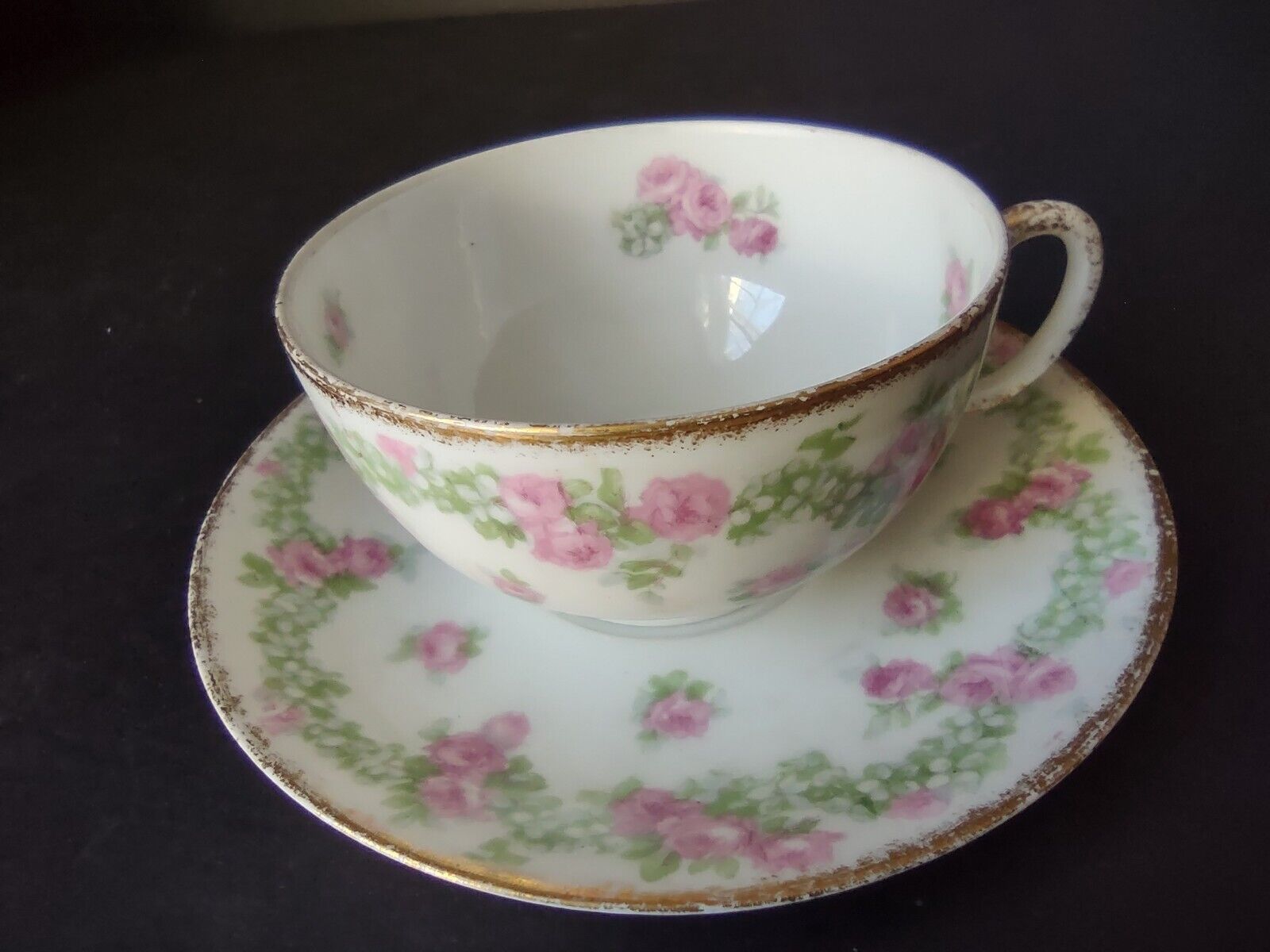 JP France Porcelain for T.G. Evans Tea Cup and Saucer Rose Garland (lot 833)
