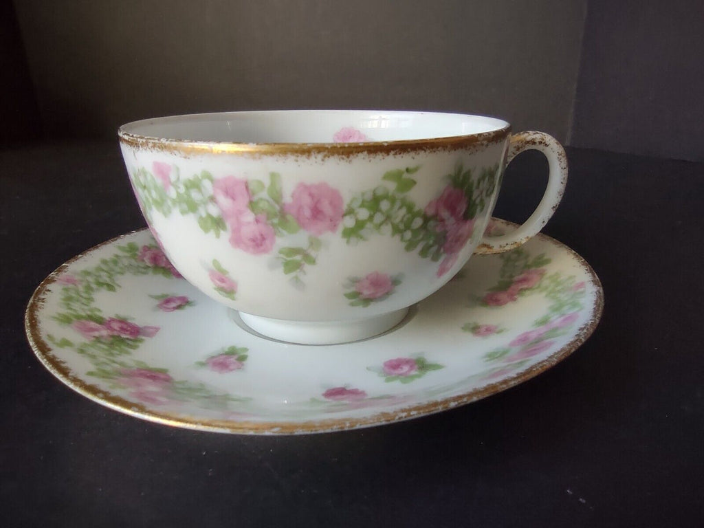 JP France Porcelain for T.G. Evans Tea Cup and Saucer Rose Garland (lot 833)