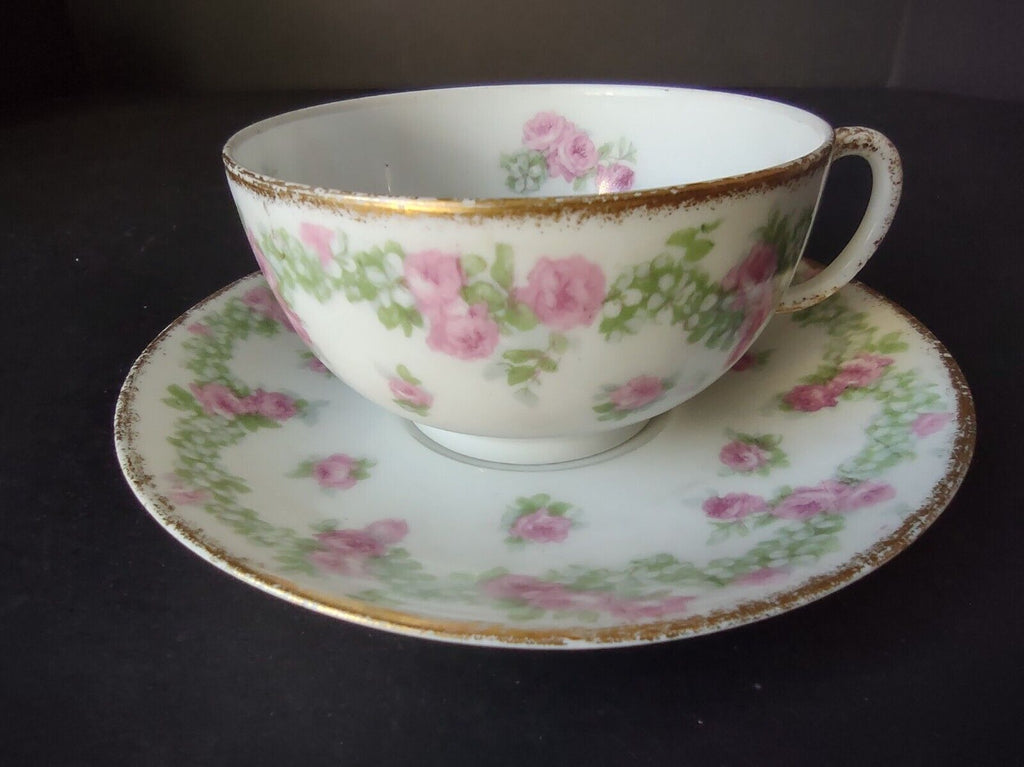 JP France Porcelain for T.G. Evans Tea Cup and Saucer Rose Garland (lot 833)