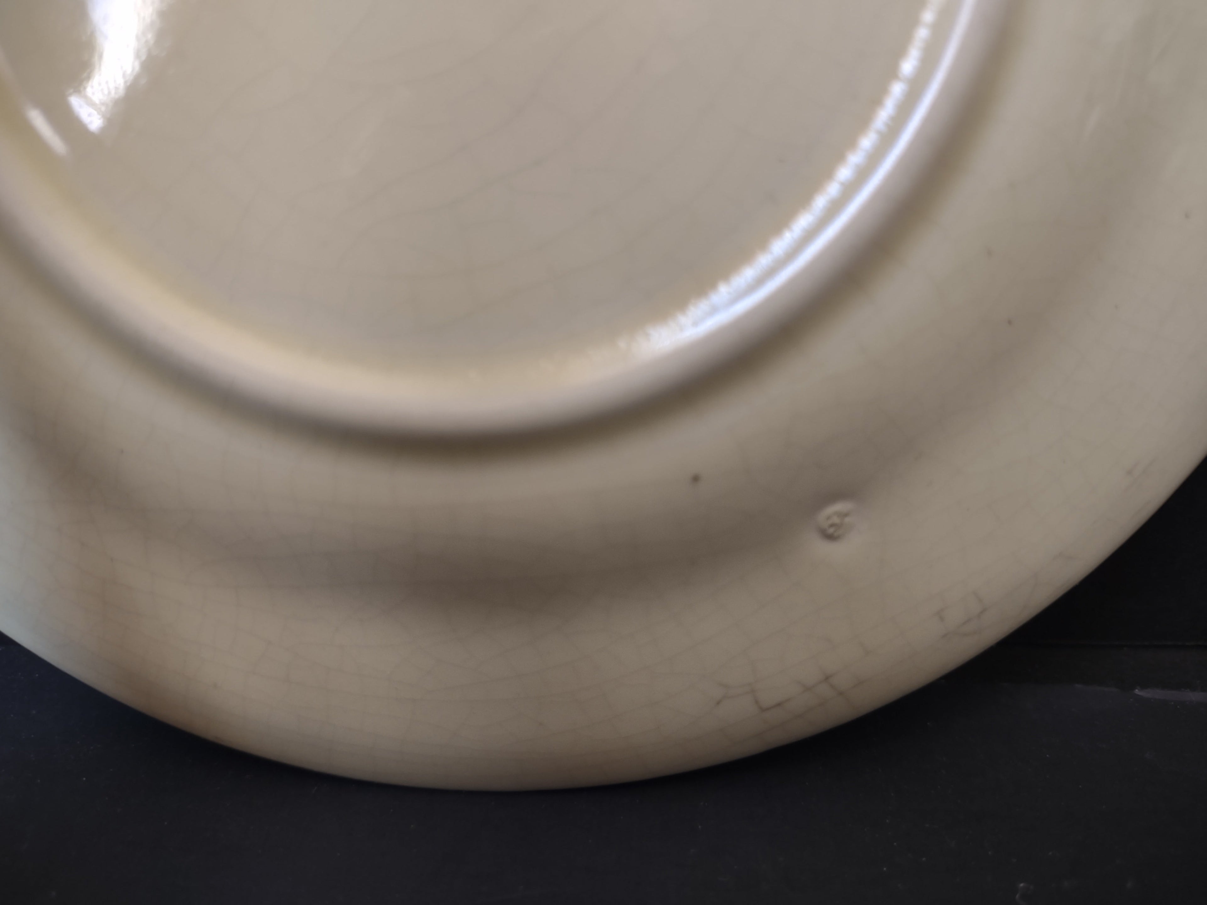 Vintage Unbranded Off-White Ribbed Rim Plate 6" - back close-up showing age discoloration