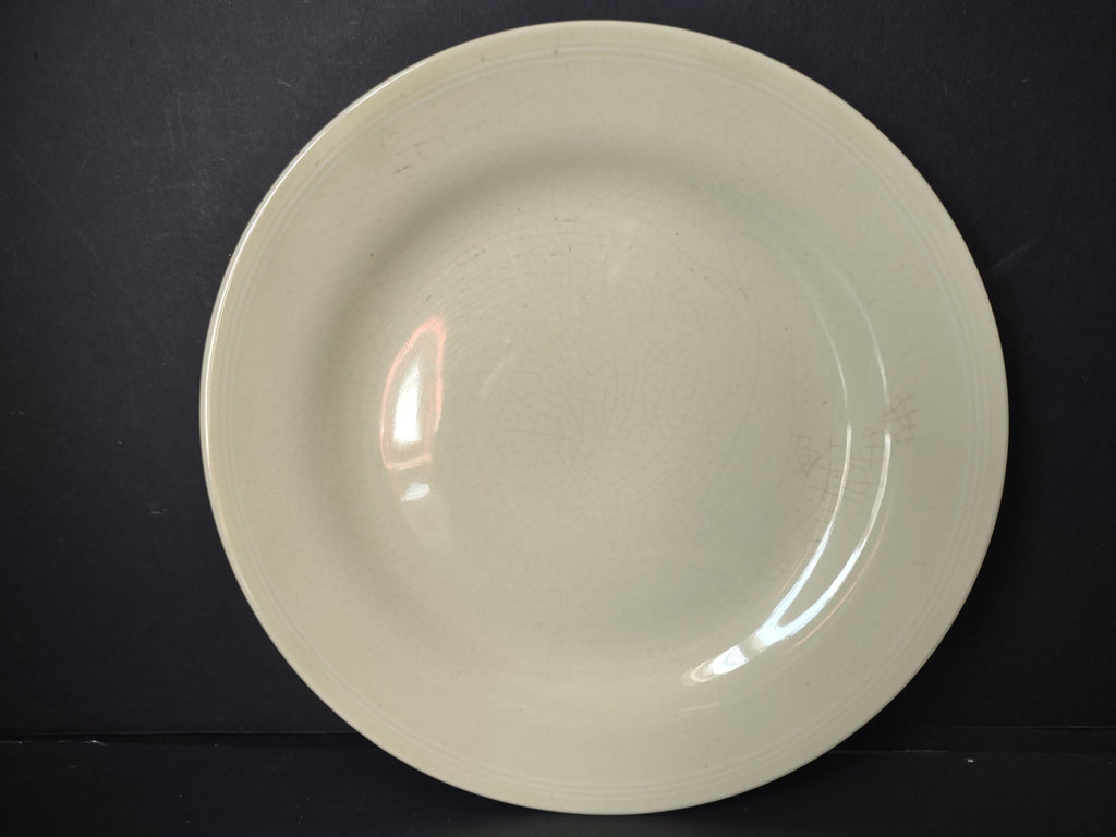 Vintage Unmarked Off-White Pale Yellow Glaze 9 inch Plate - full front view