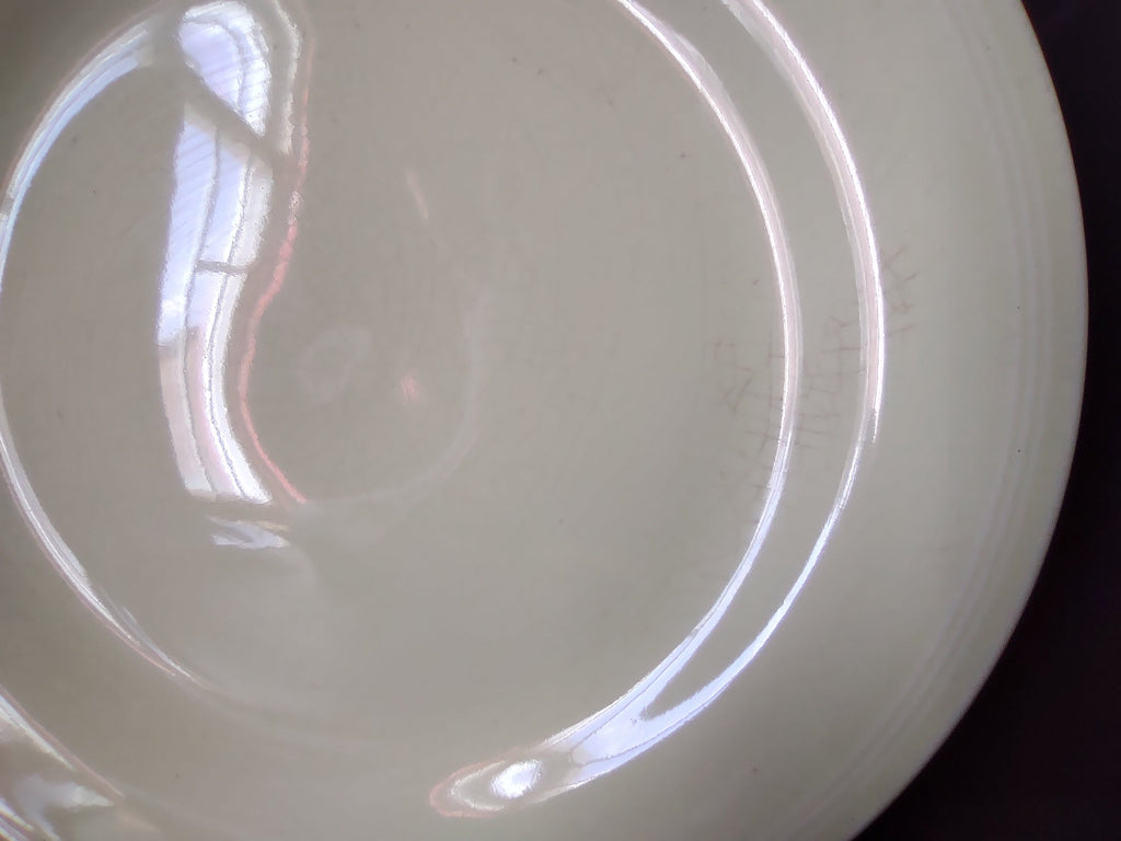 Vintage Unmarked Off-White Pale Yellow Glaze 9 inch Plate - back showing concentric rings