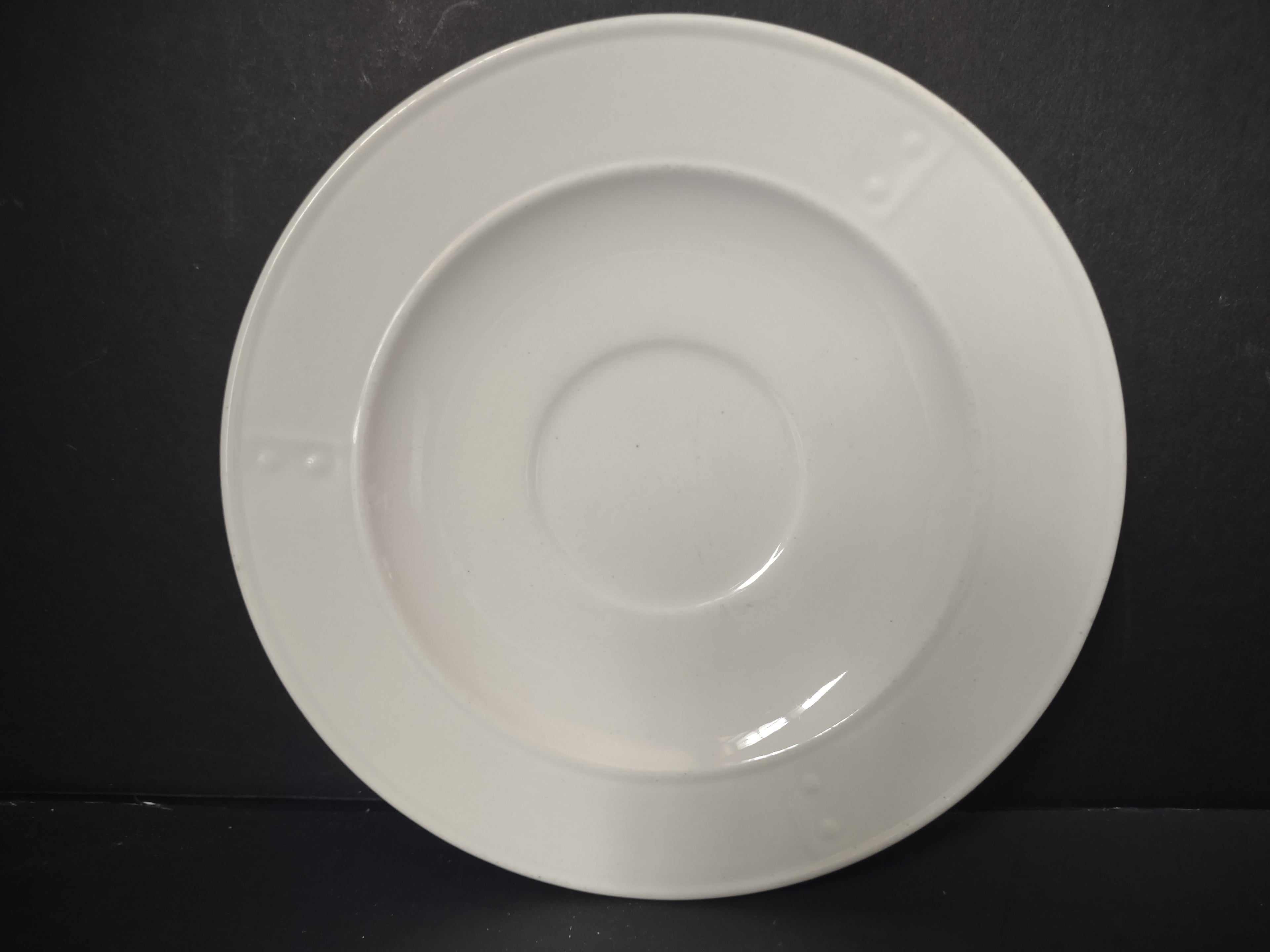 Metlox Poppytrail plain white saucer top view showing cup ring and wide rim