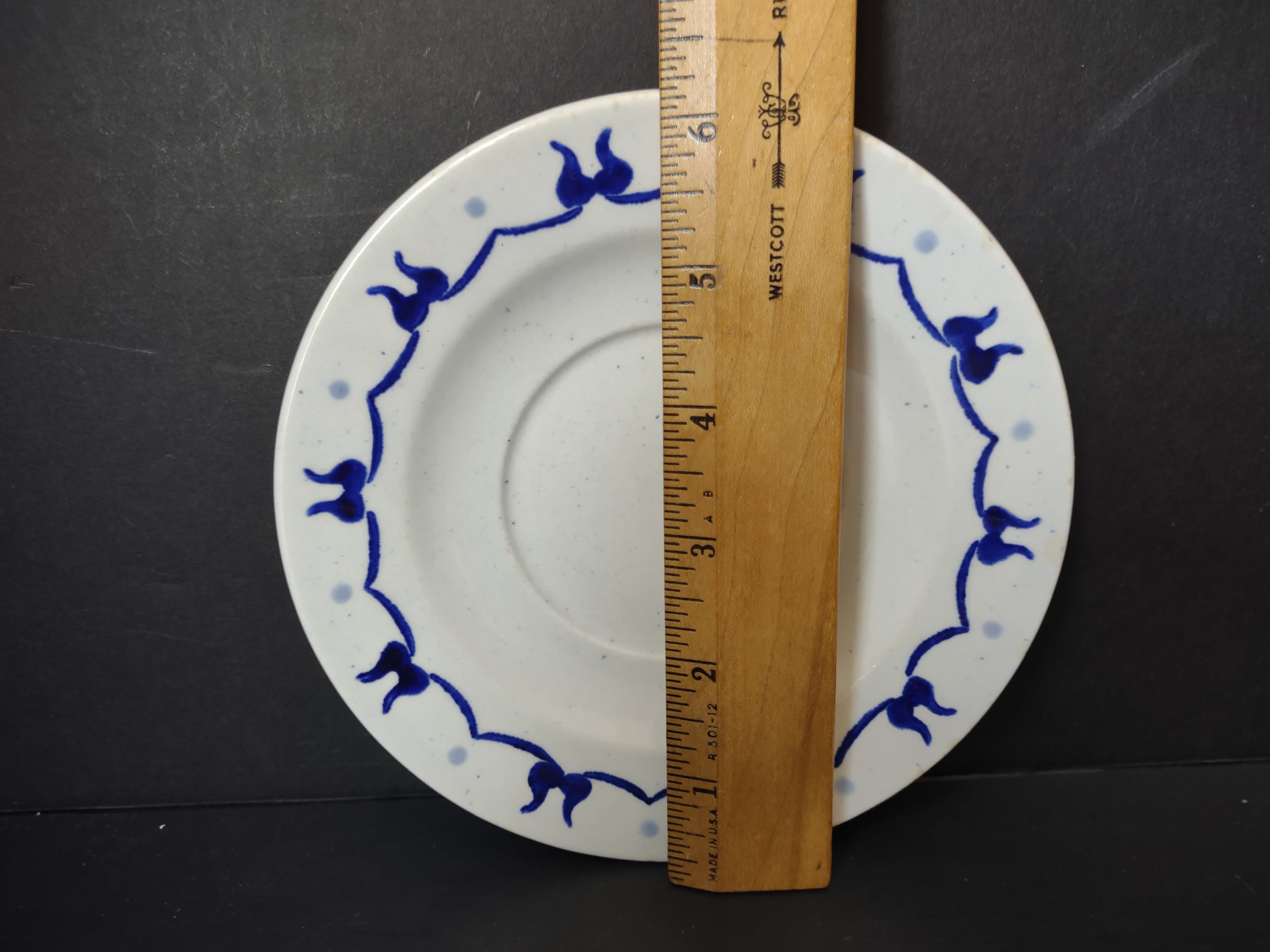 Vintage Metlox Poppytrail Homestead Provincial Saucer - size reference with ruler showing approximately 5.5 inches