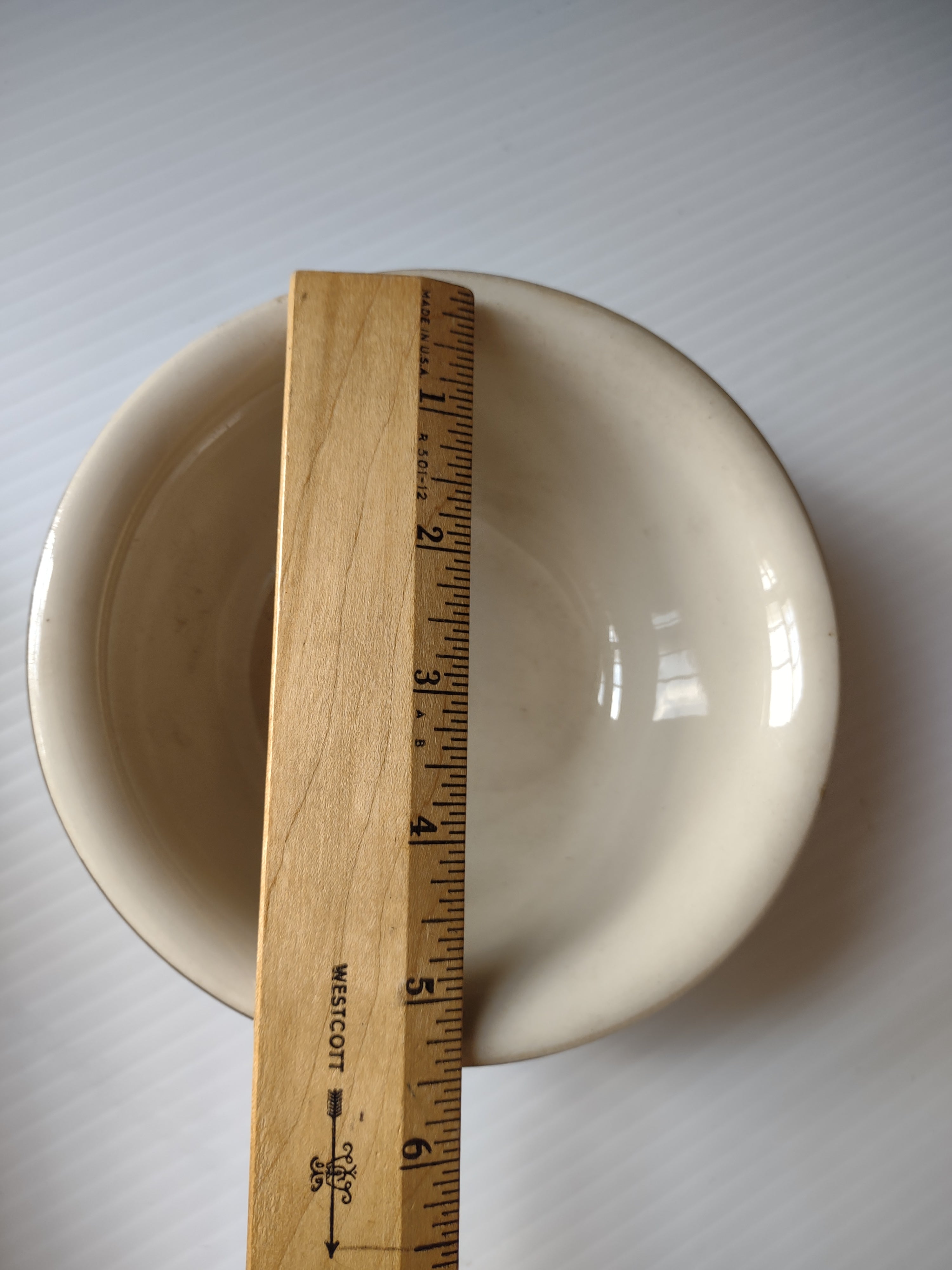Interior view of Bel-Terr stoneware mixing bowl showing off-white glaze