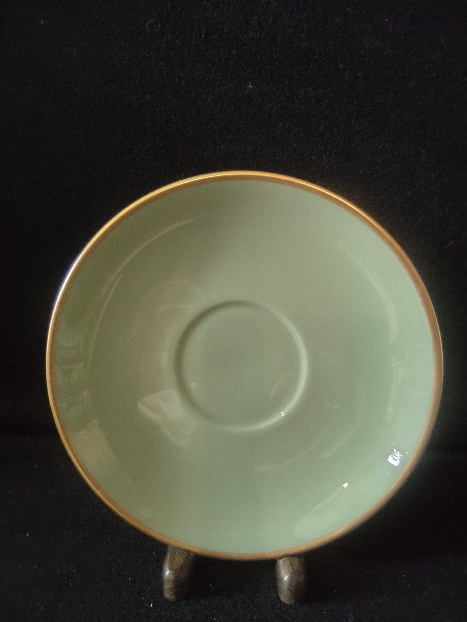 Vintage Flintridge China celadon green gold rim saucer - interior close-up showing light surface wear