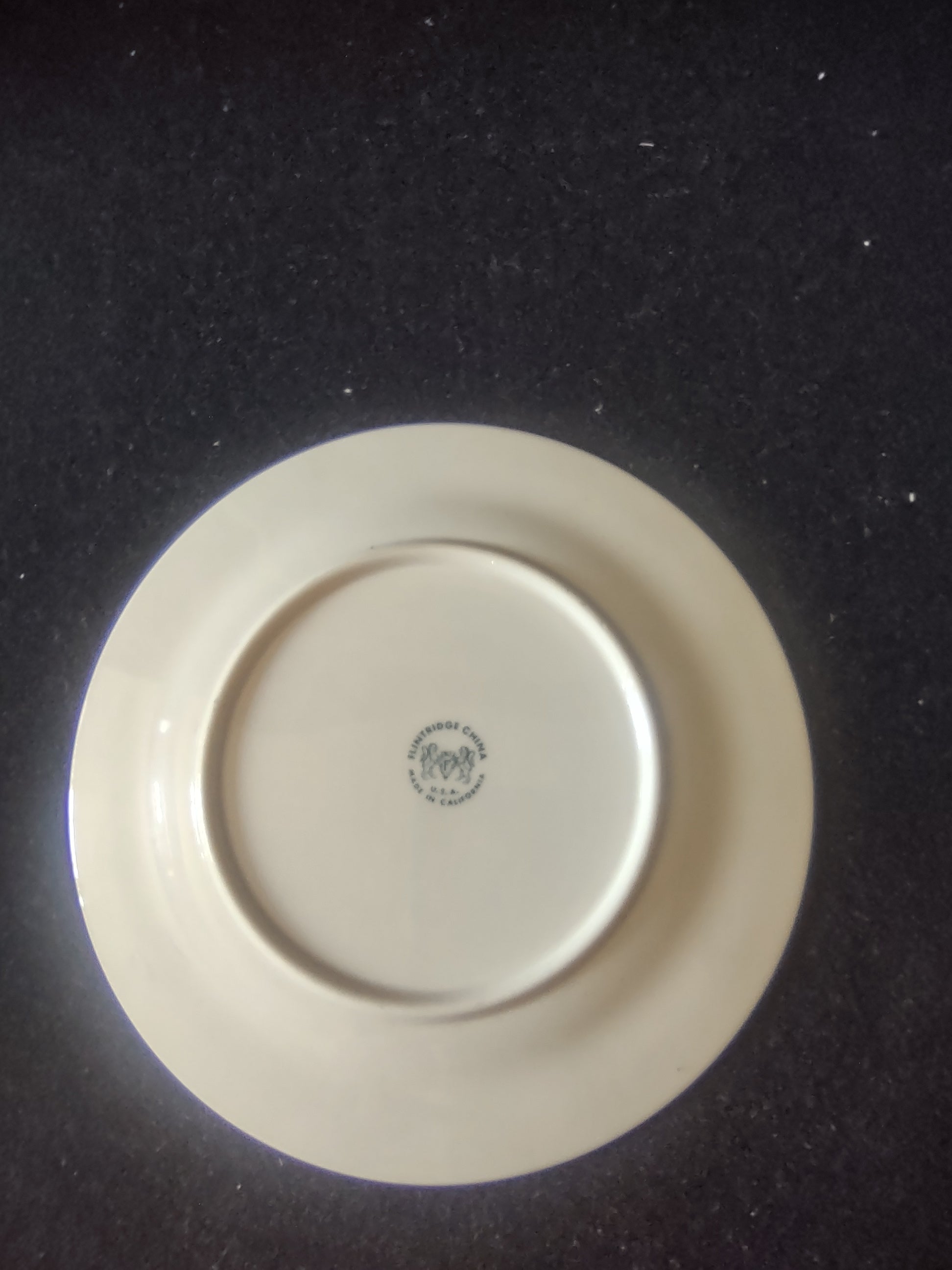 Vintage Flintridge China celadon green floral plate - close-up of celadon green border and gold rim wear