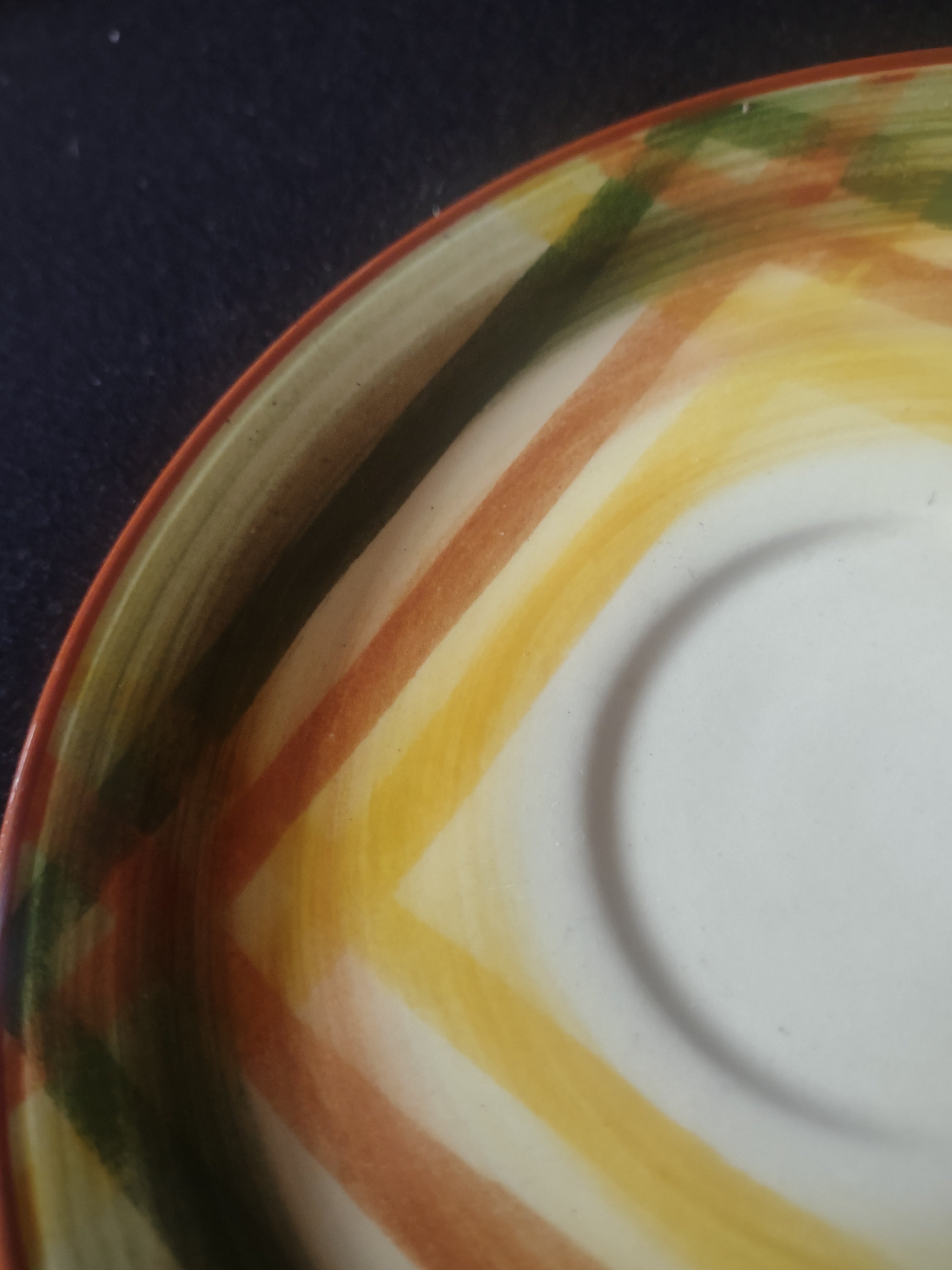Vernon Kilns Homespun saucer with ruler showing approximately 6 inch diameter
