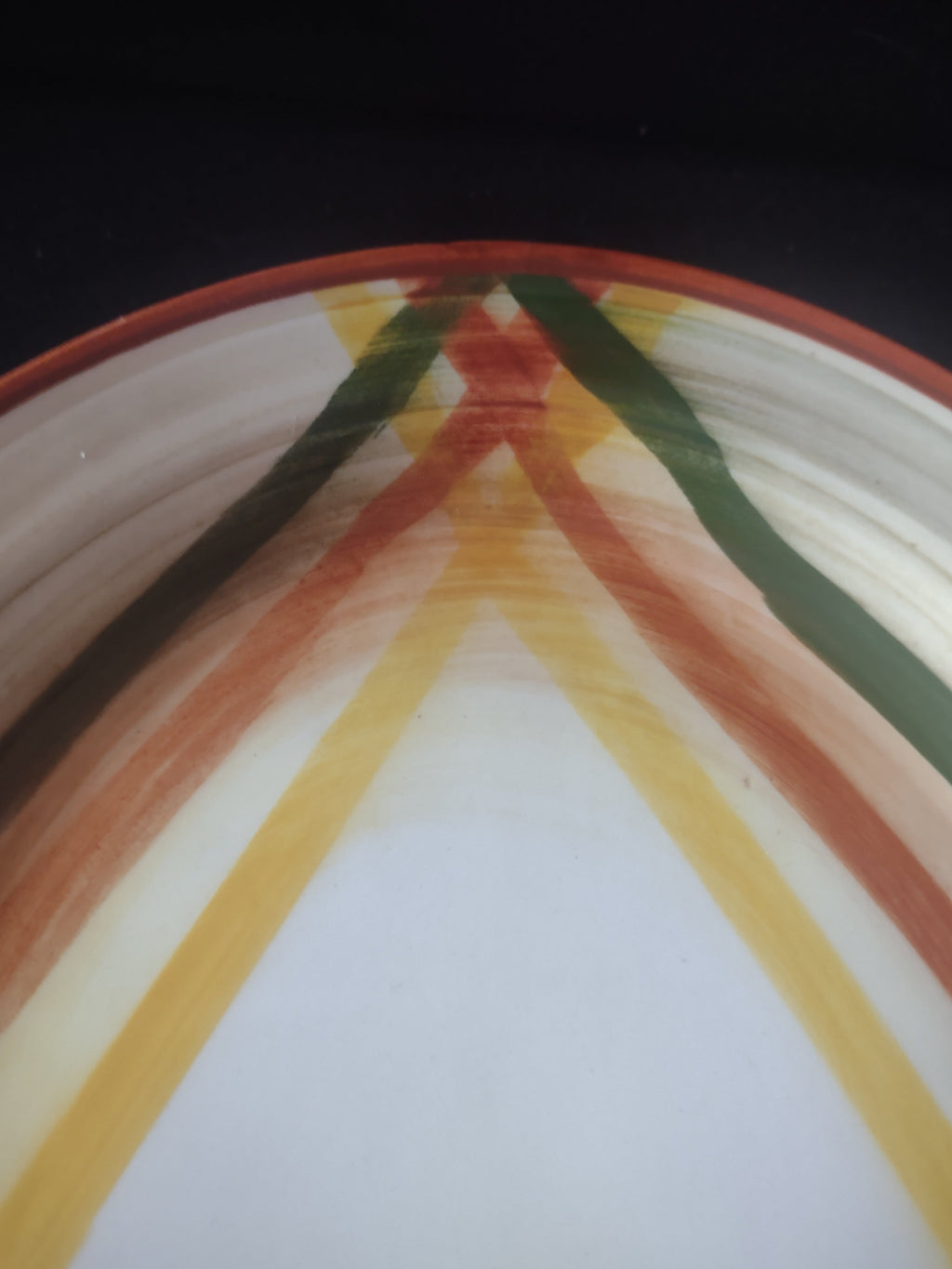 Vintage plaid oval platter with ruler showing approximately 13 inches length