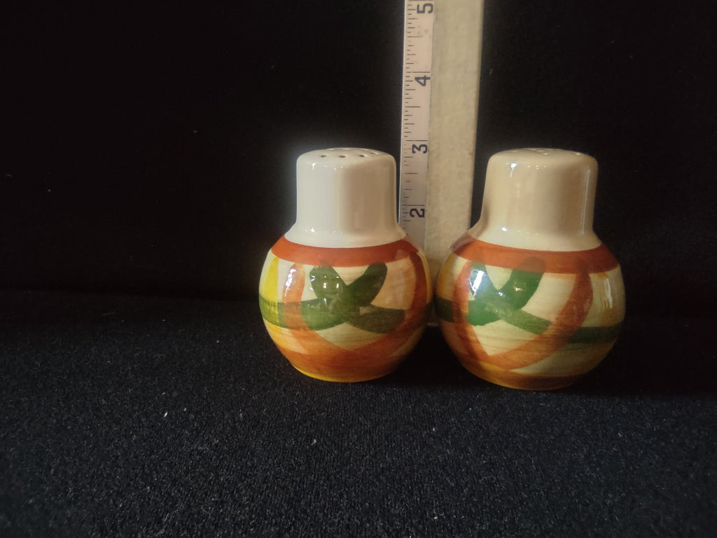 Vintage Vintonware Salt & Pepper Shakers front view close-up showing green leaf brushstroke decoration and orange banding