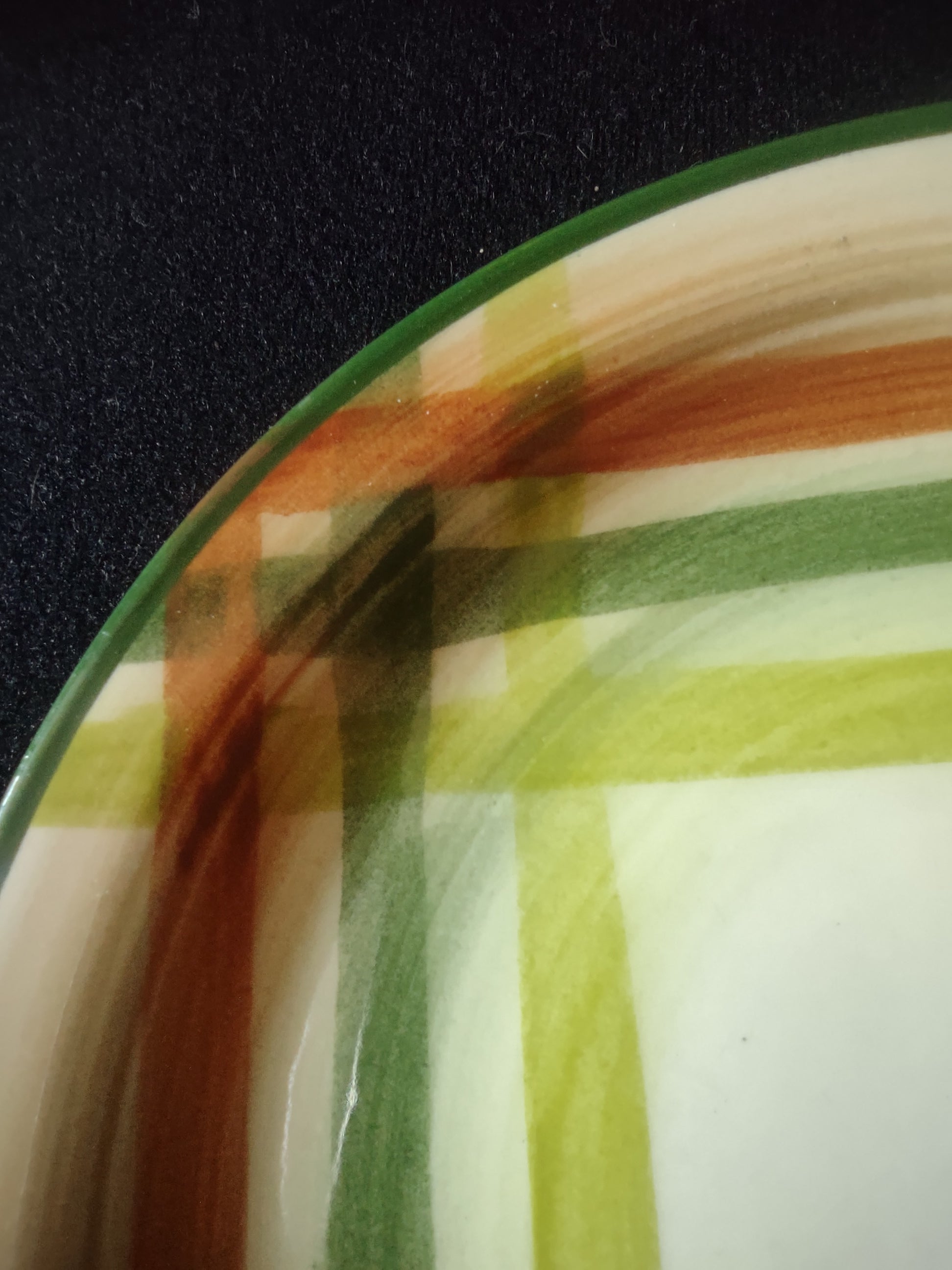 Tam O'Shanter Plaid pattern close-up showing forest green, olive, and rust-orange brushstrokes