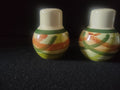 Vernonware Tam O'Shanter salt and pepper shakers front view showing orange and green brushstroke pattern