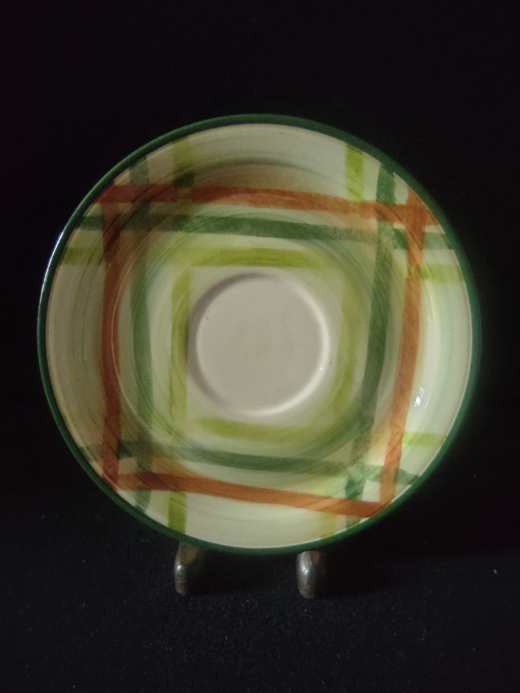 Vernon Kilns Tam O'Shanter saucer close-up showing green and orange plaid pattern detail