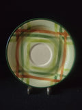 Vernon Kilns Tam O'Shanter saucer close-up showing green and orange plaid pattern detail