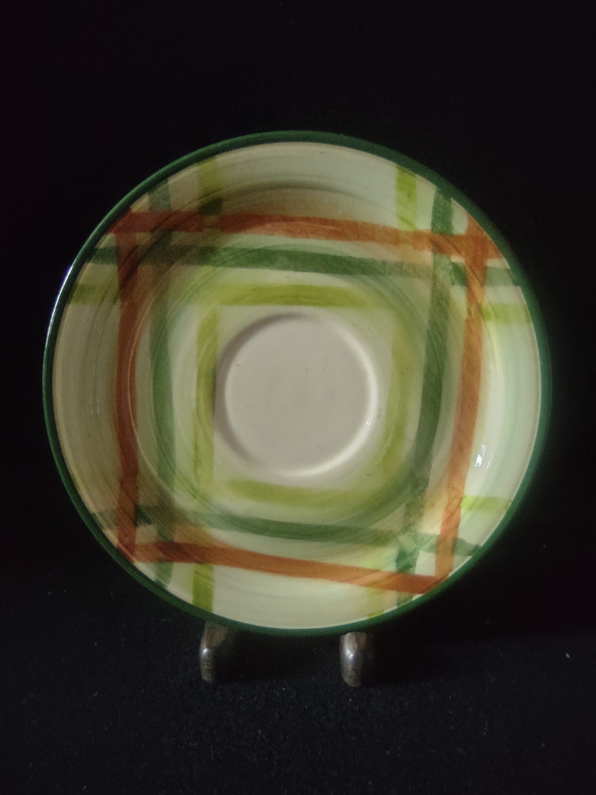 Vernon Kilns Tam O'Shanter saucer close-up showing green and orange plaid pattern detail