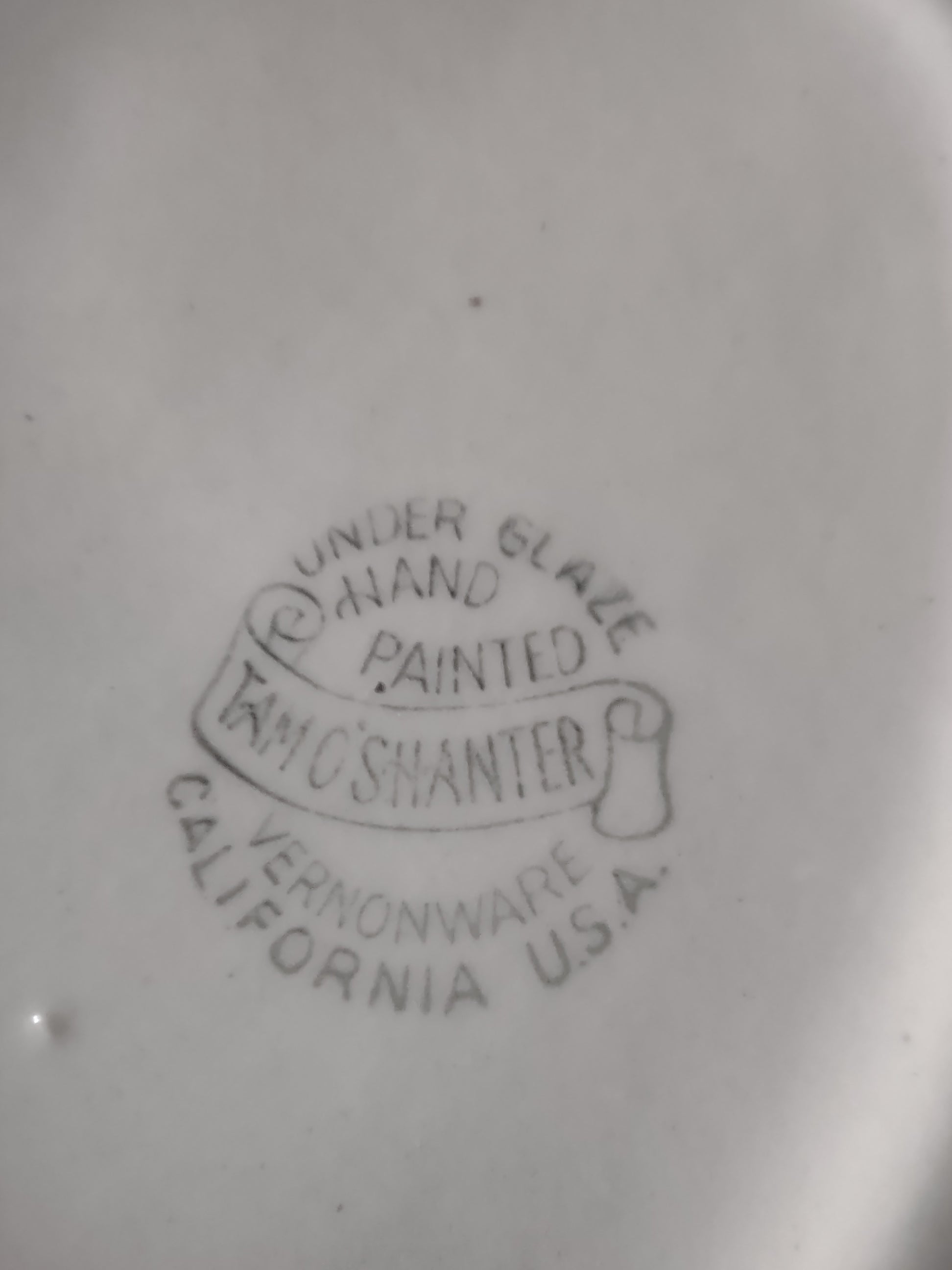Vernonware Tam O'Shanter oval platter front view on display stand