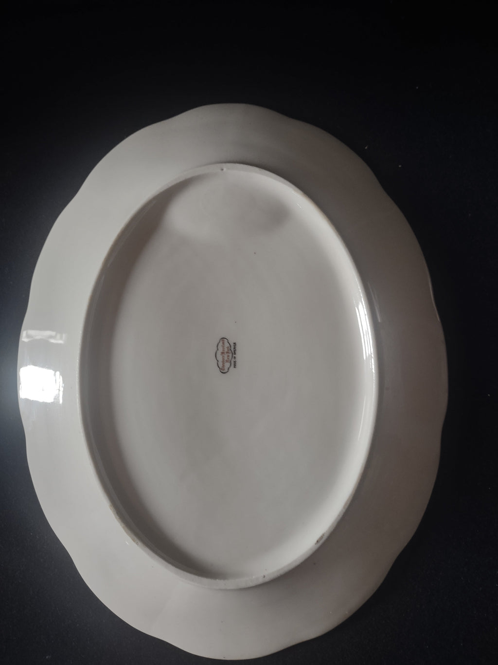 Vintage Theodore Haviland white and gold laurel oval serving platter - front view on stand