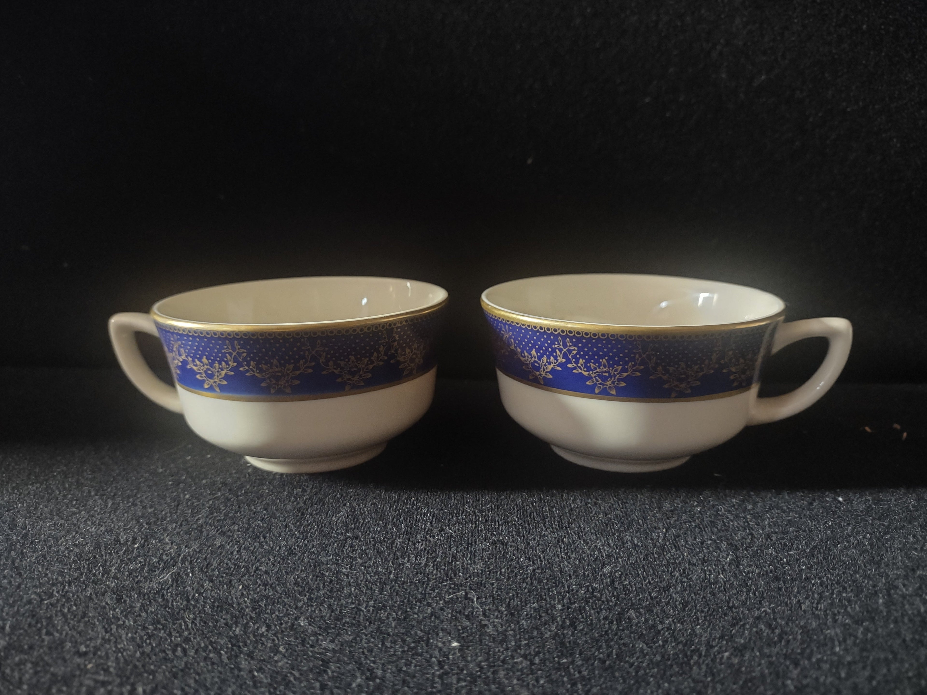Vintage O.P.Co. Syracuse China W-12 cobalt blue gold teacup set of 2, front view showing both cups