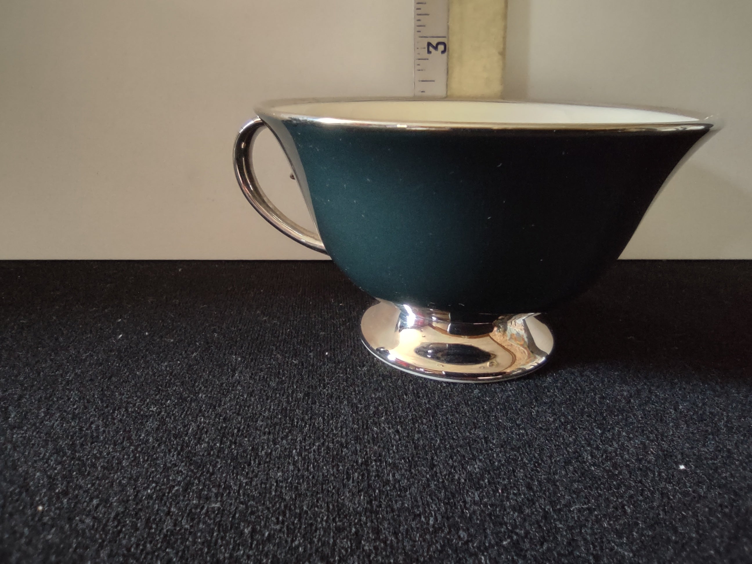 Flintridge China teal footed cup top-down view showing interior and platinum handle