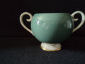 Vintage Flintridge China teal open sugar bowl with ruler showing approximately 4 inches tall - side view with scroll handles and gold trim foot