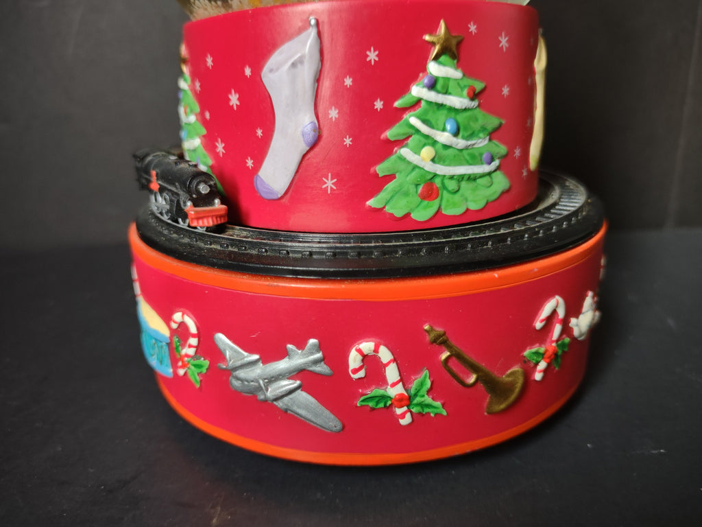 Vintage Coca-Cola Hallmark musical snow globe side view showing full tiered base with train locomotive and Christmas tree