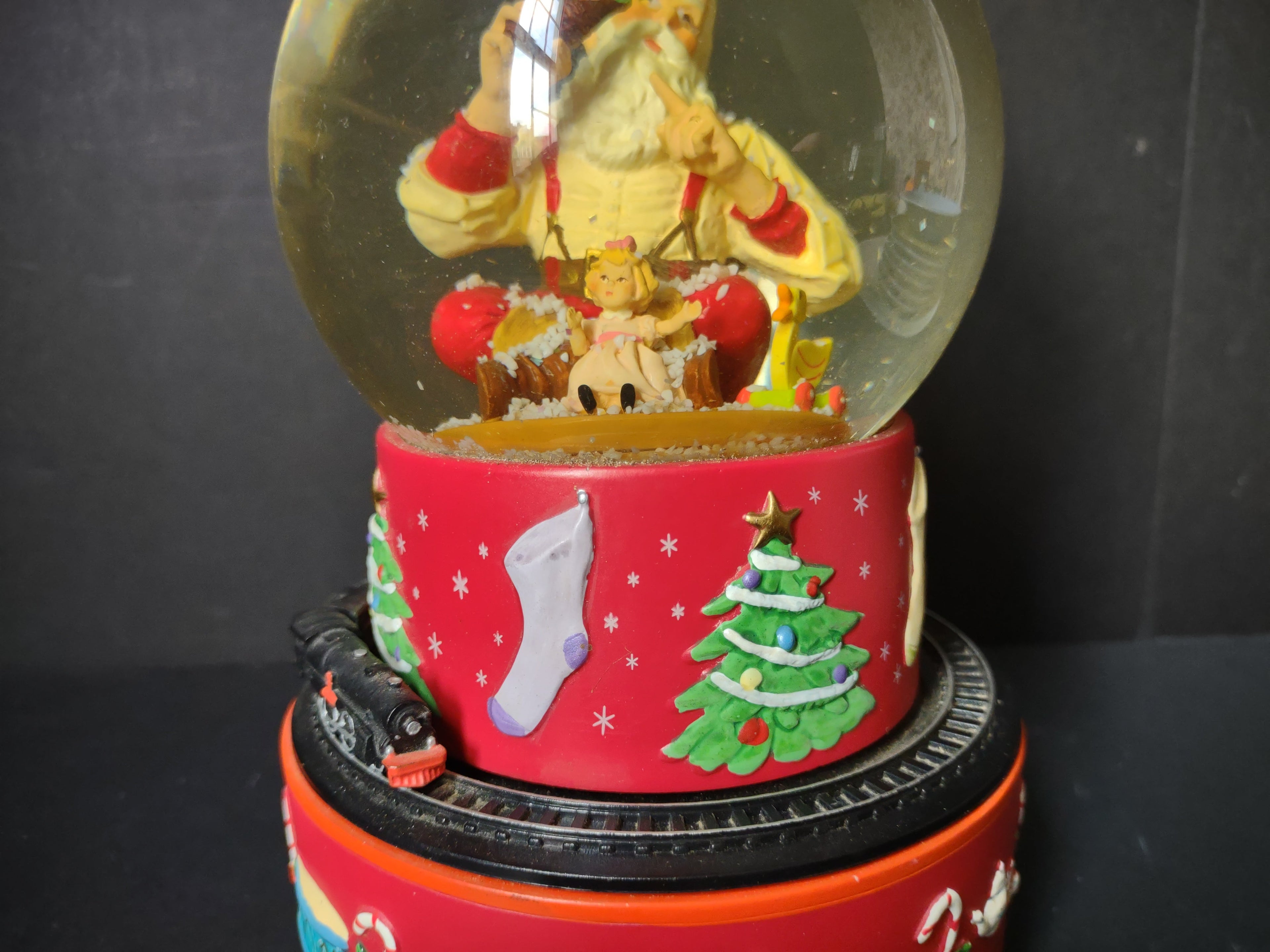 Vintage Coca-Cola Hallmark musical snow globe full view with snow swirling inside globe showing Santa Claus figure