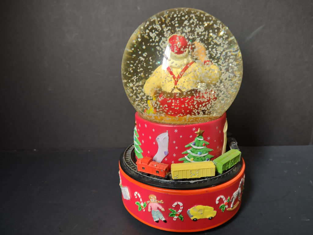 Vintage Coca-Cola Hallmark musical snow globe bottom view showing Coca-Cola branding and music label