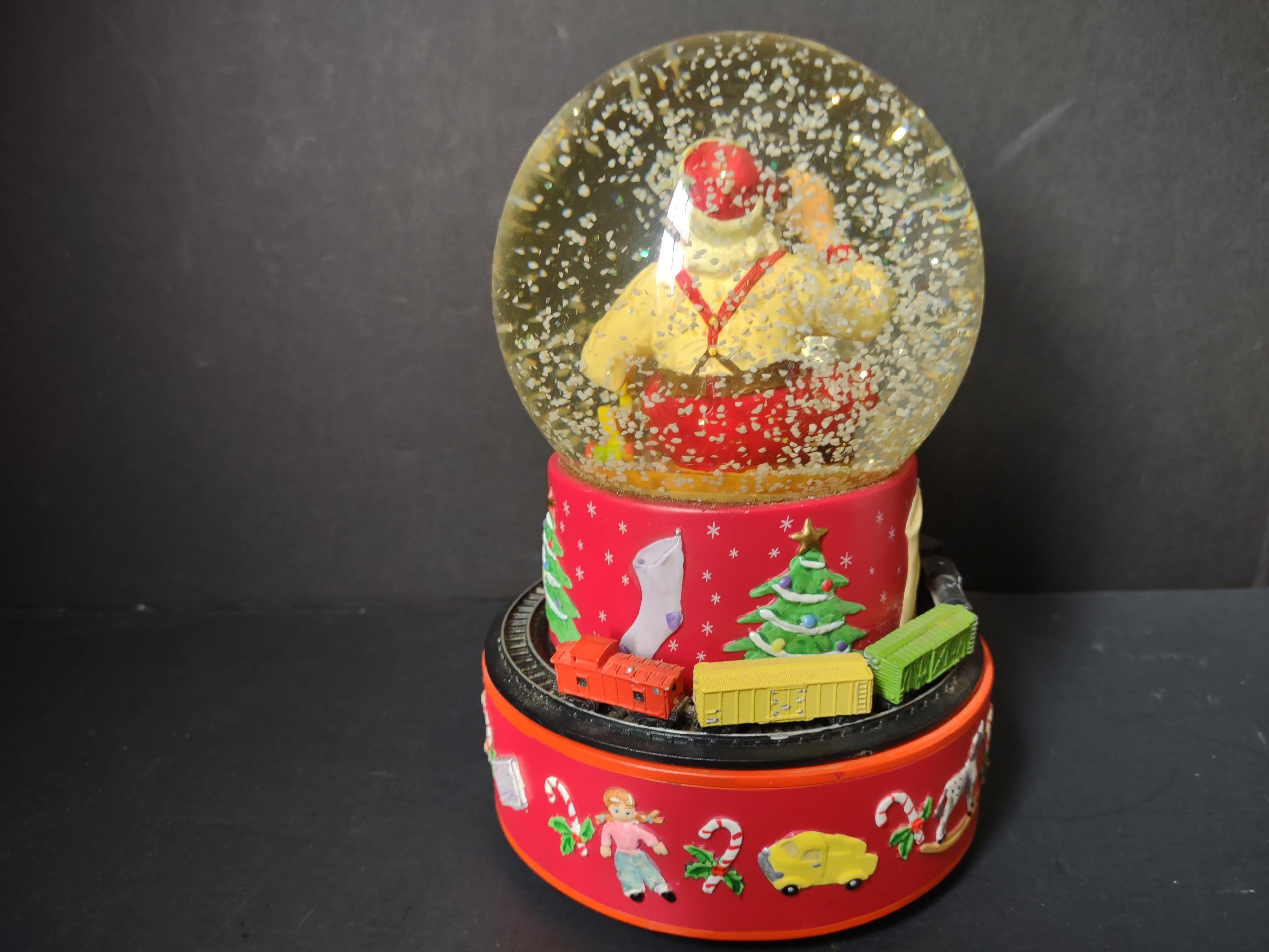 Vintage Coca-Cola Hallmark musical snow globe bottom view showing Coca-Cola branding and music label