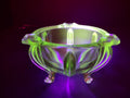 Vintage green uranium glass footed bowl close-up of foot showing chip damage