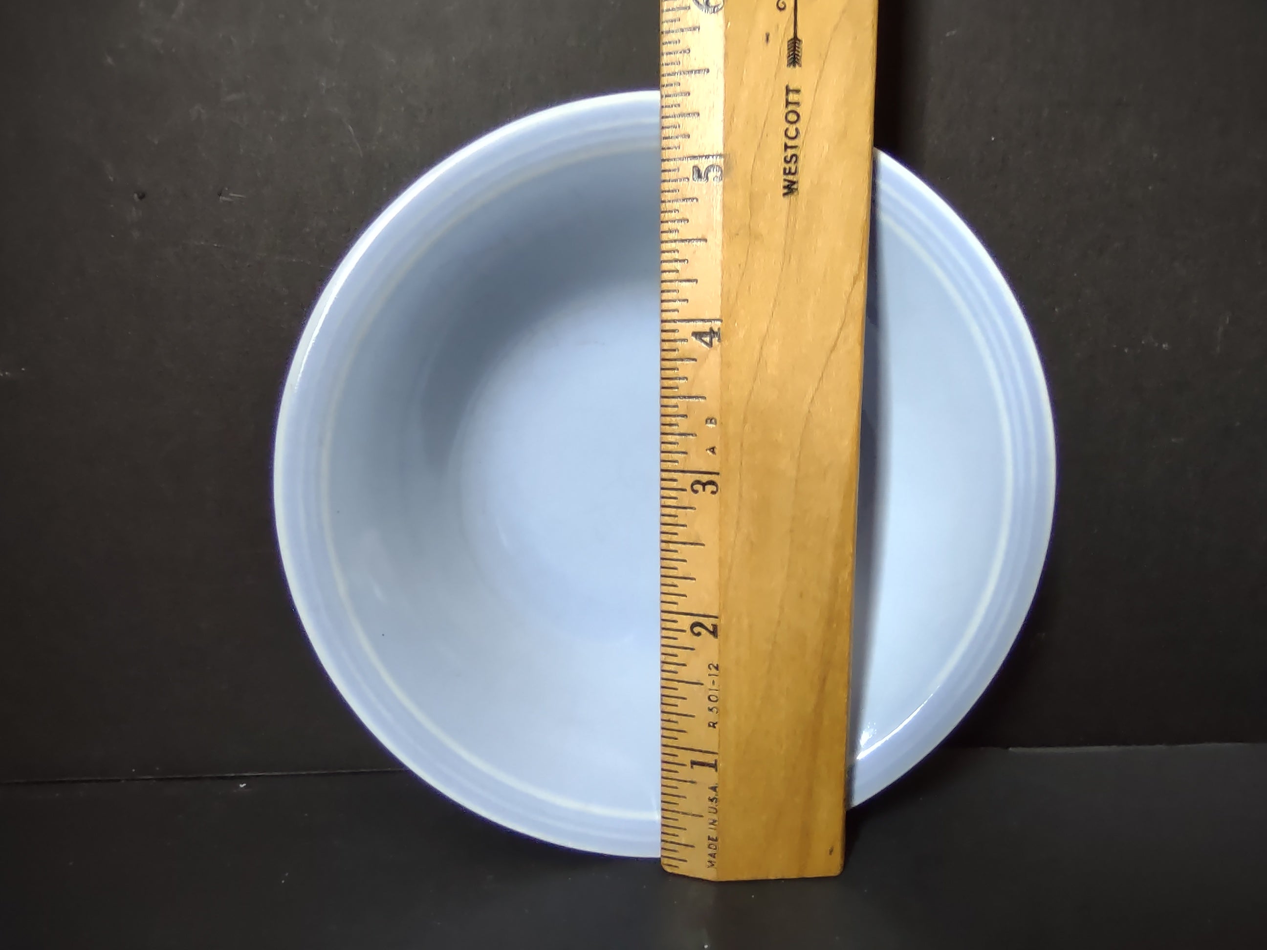 Vintage Russel Wright American Modern ice blue coupe soup bowl with ruler showing approximately 9 inch diameter