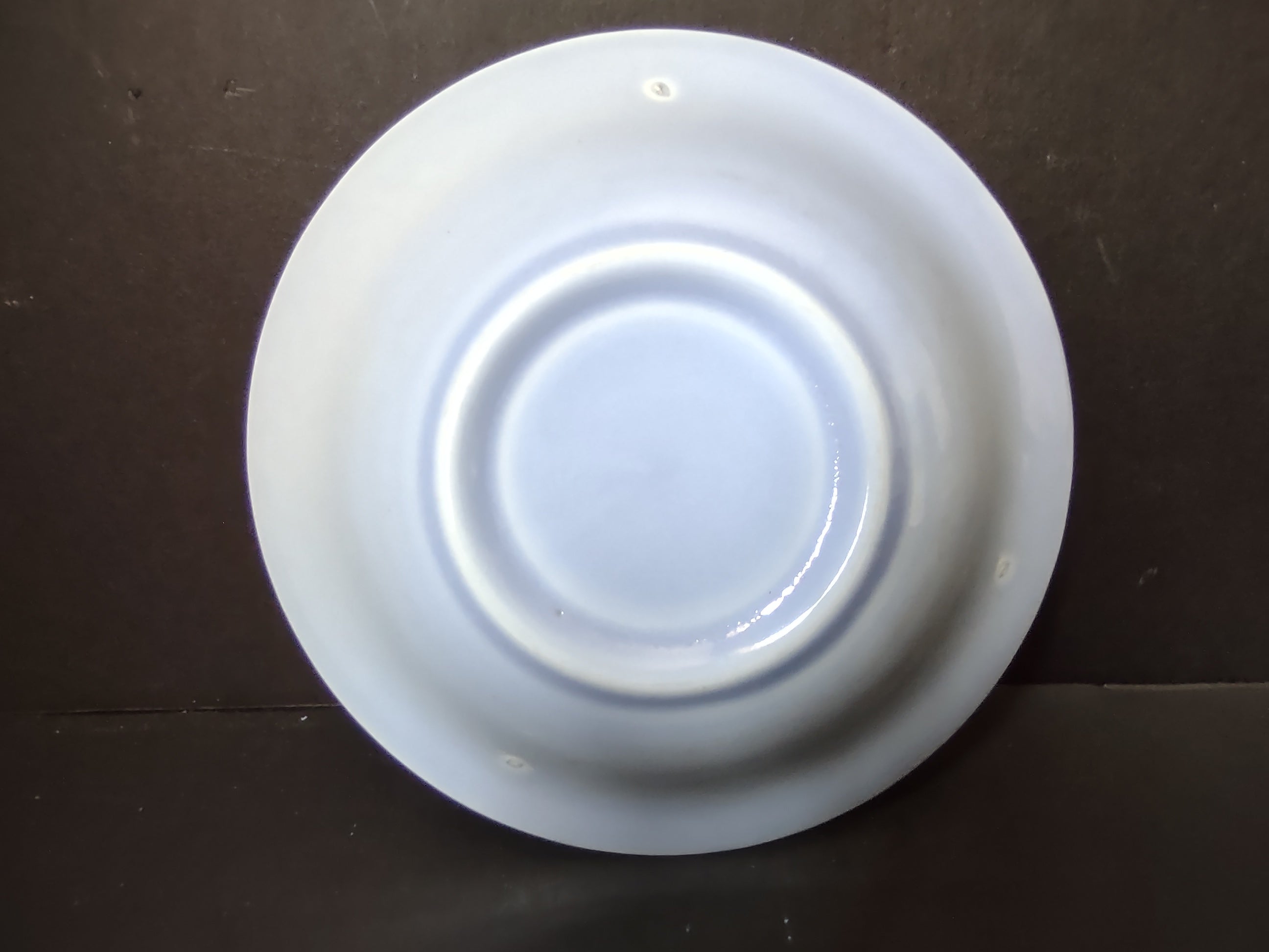 Vintage Russel Wright American Modern ice blue coupe soup bowl top view showing wide flat rim and shallow bowl