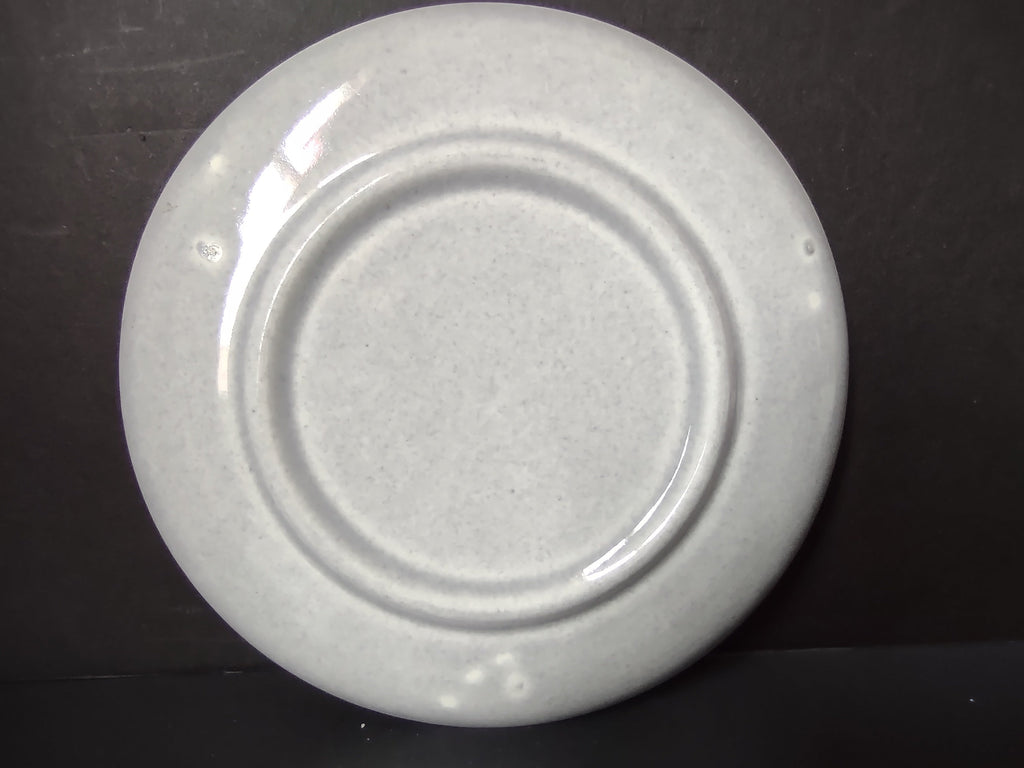 Vintage white unbranded saucer with ruler showing approximately 6 inch diameter