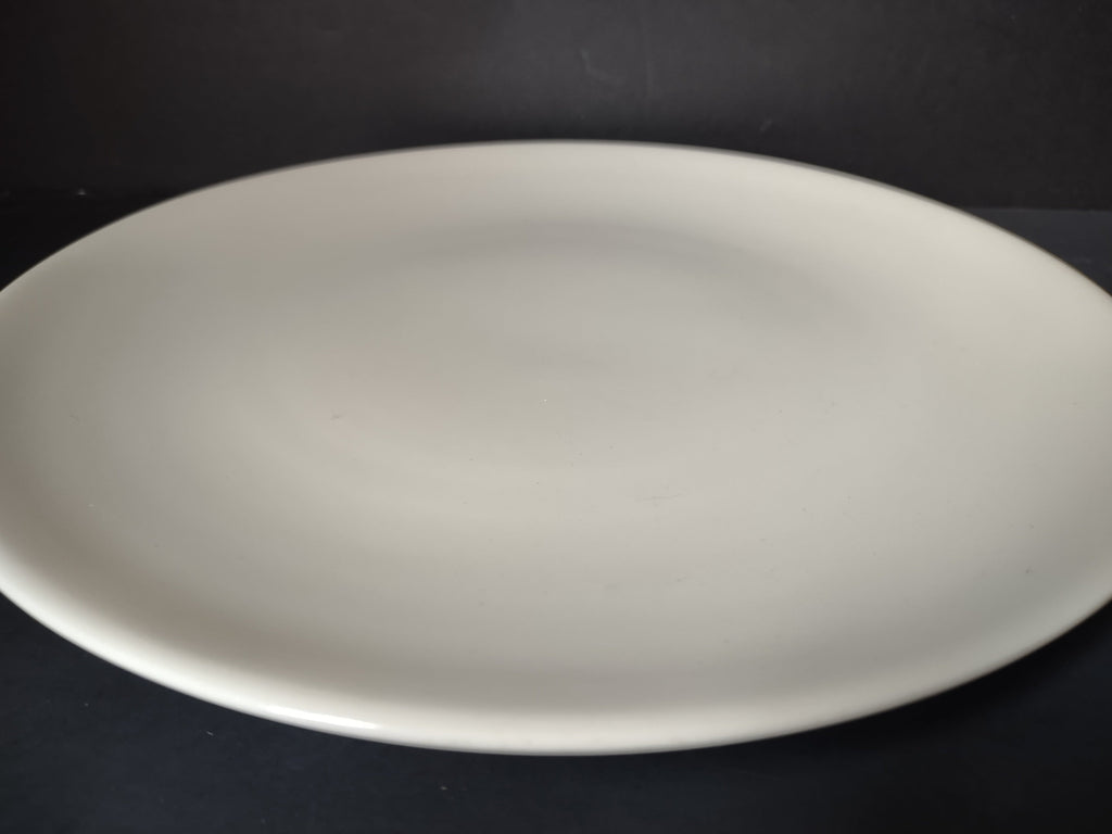 Vintage Peter Terris Original white coupe plate - angled side view showing coupe profile
