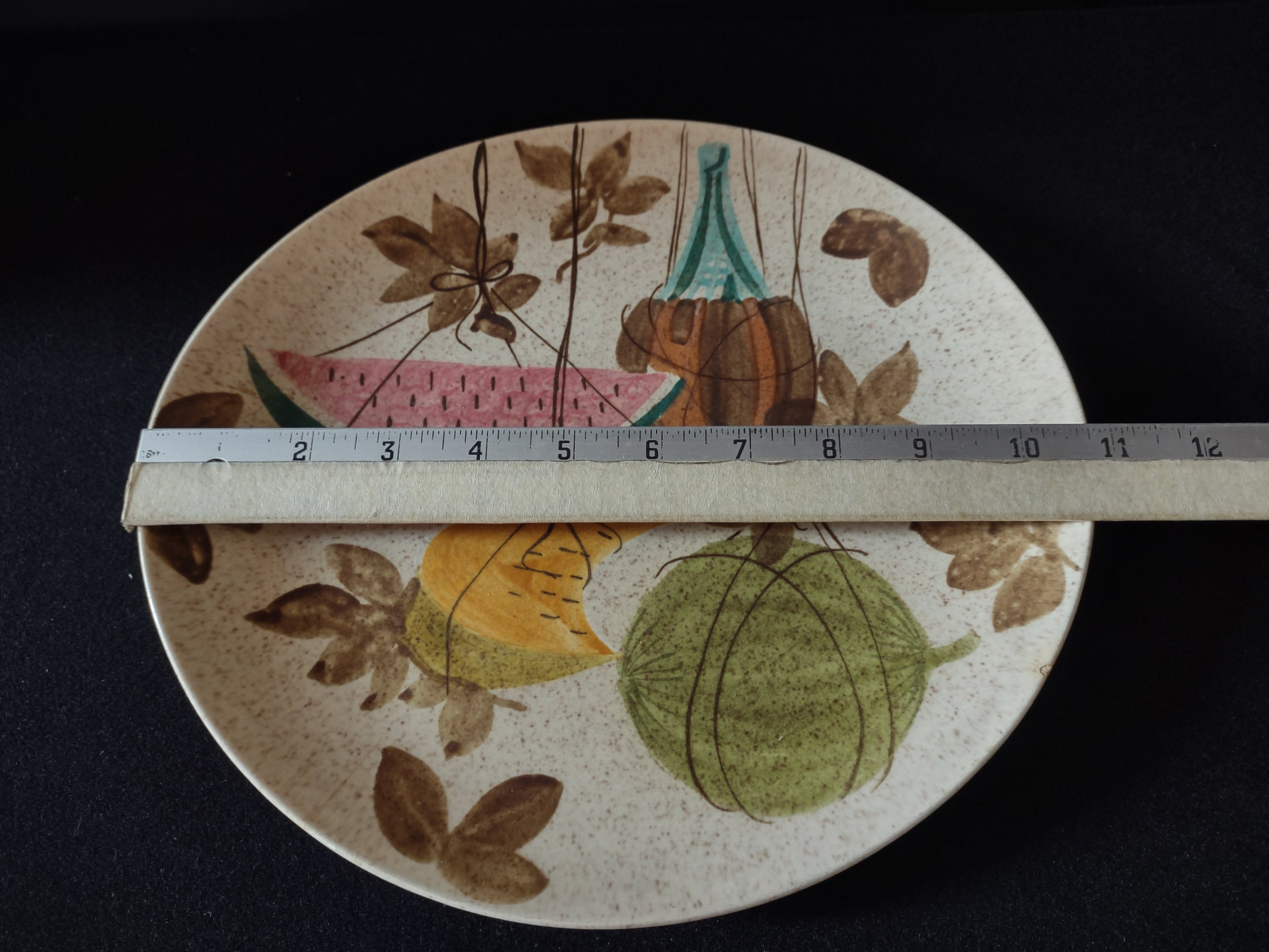 Vintage Red Wing Hand Painted Tampico Plate USA - close-up of pumpkin and teal bottle motif