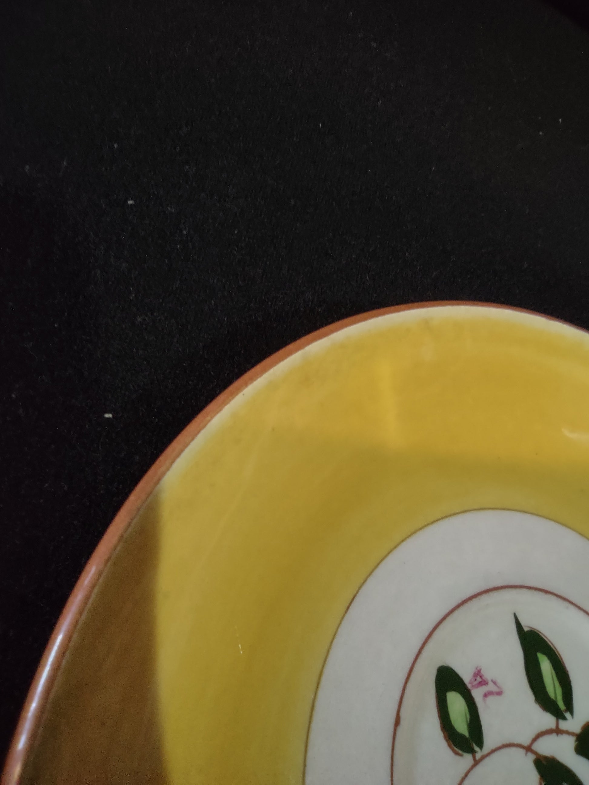 Vintage Stangl Pottery Blueberry Yellow Saucer - rim close-up showing yellow glaze and terra cotta edge