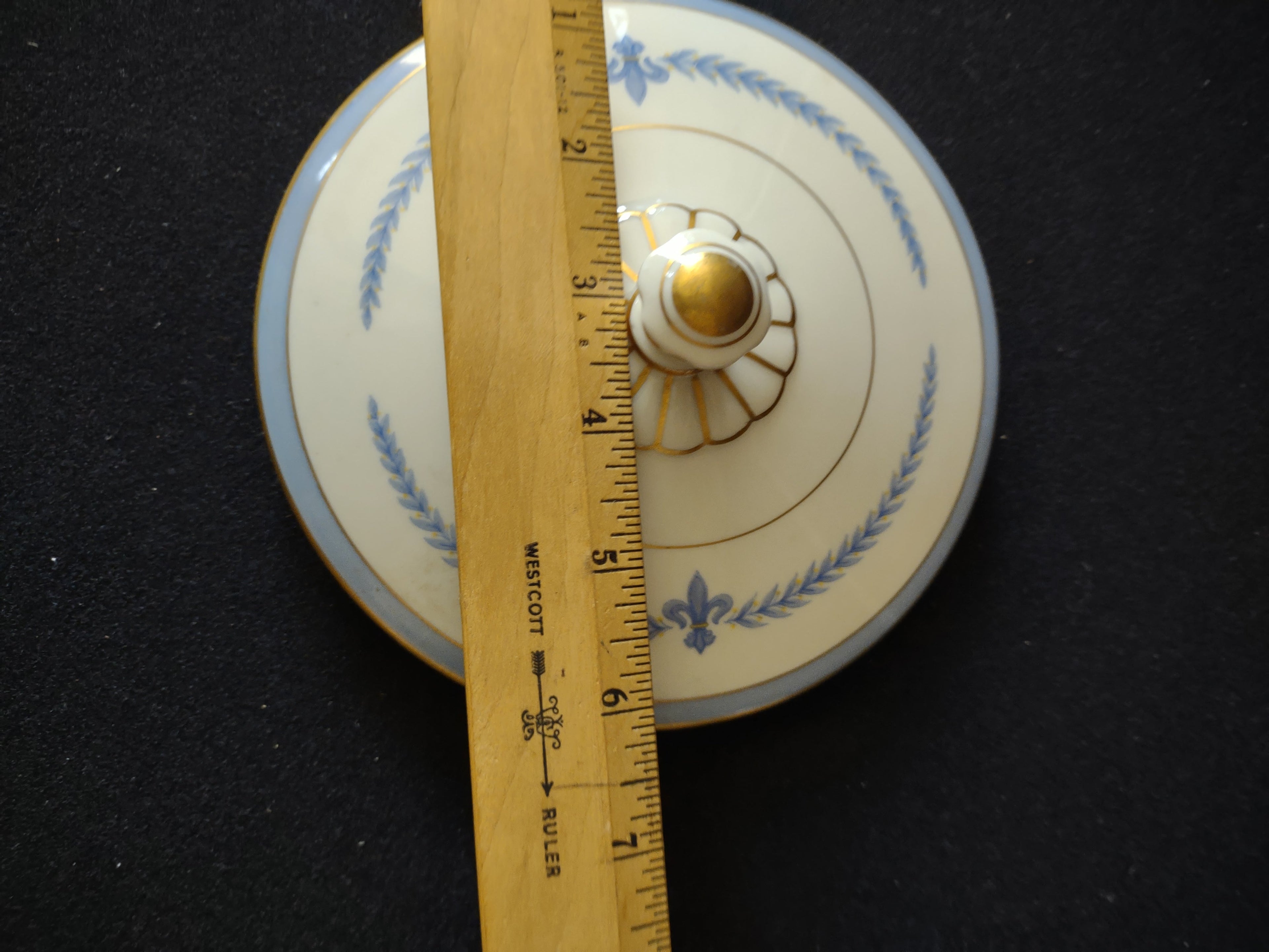Vintage Blue & Gold Fleur-de-Lis Porcelain Lid [6902] - top view with ruler showing approx 5.5 inch diameter