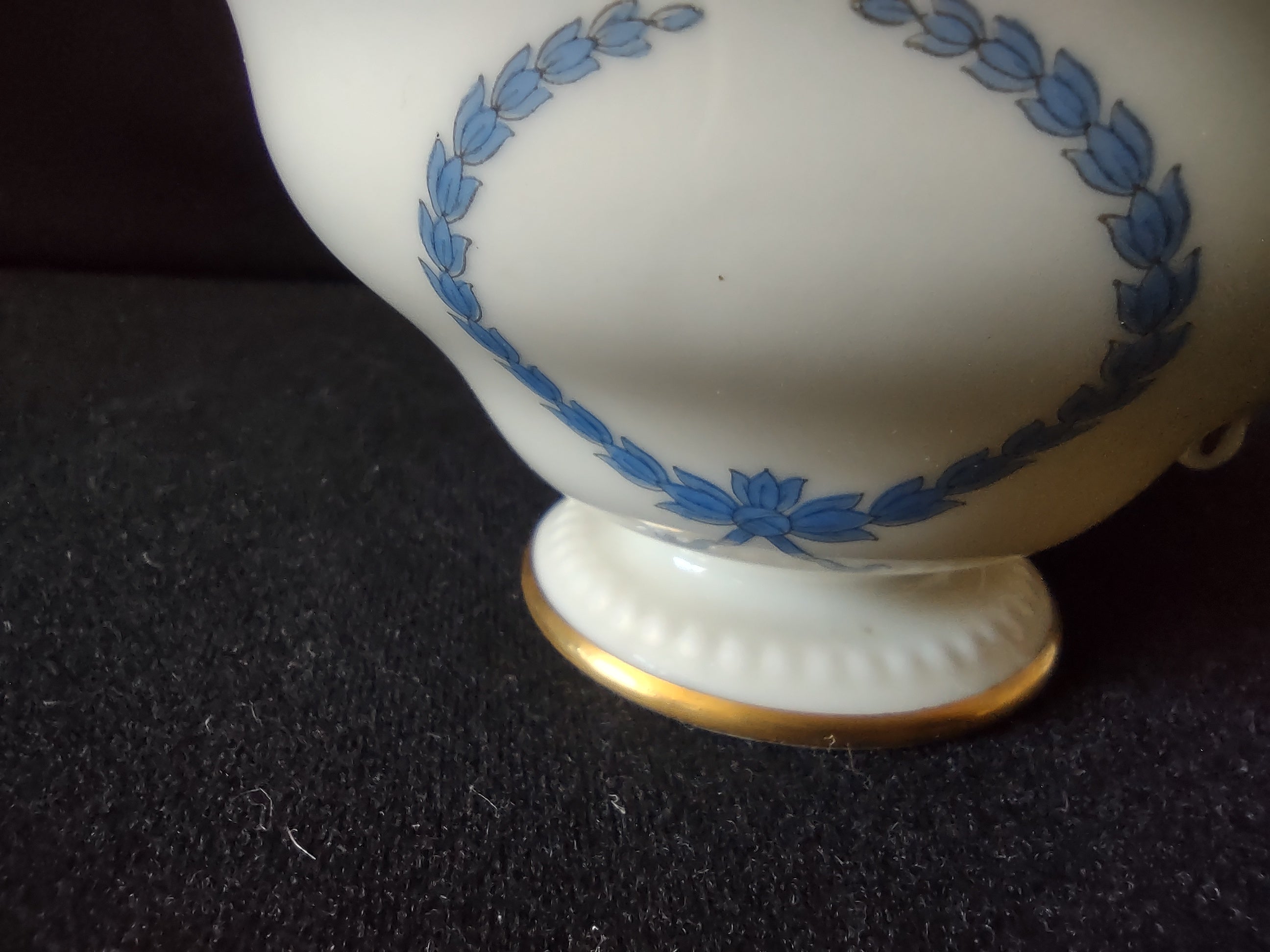 Cup exterior showing full blue laurel wreath motif