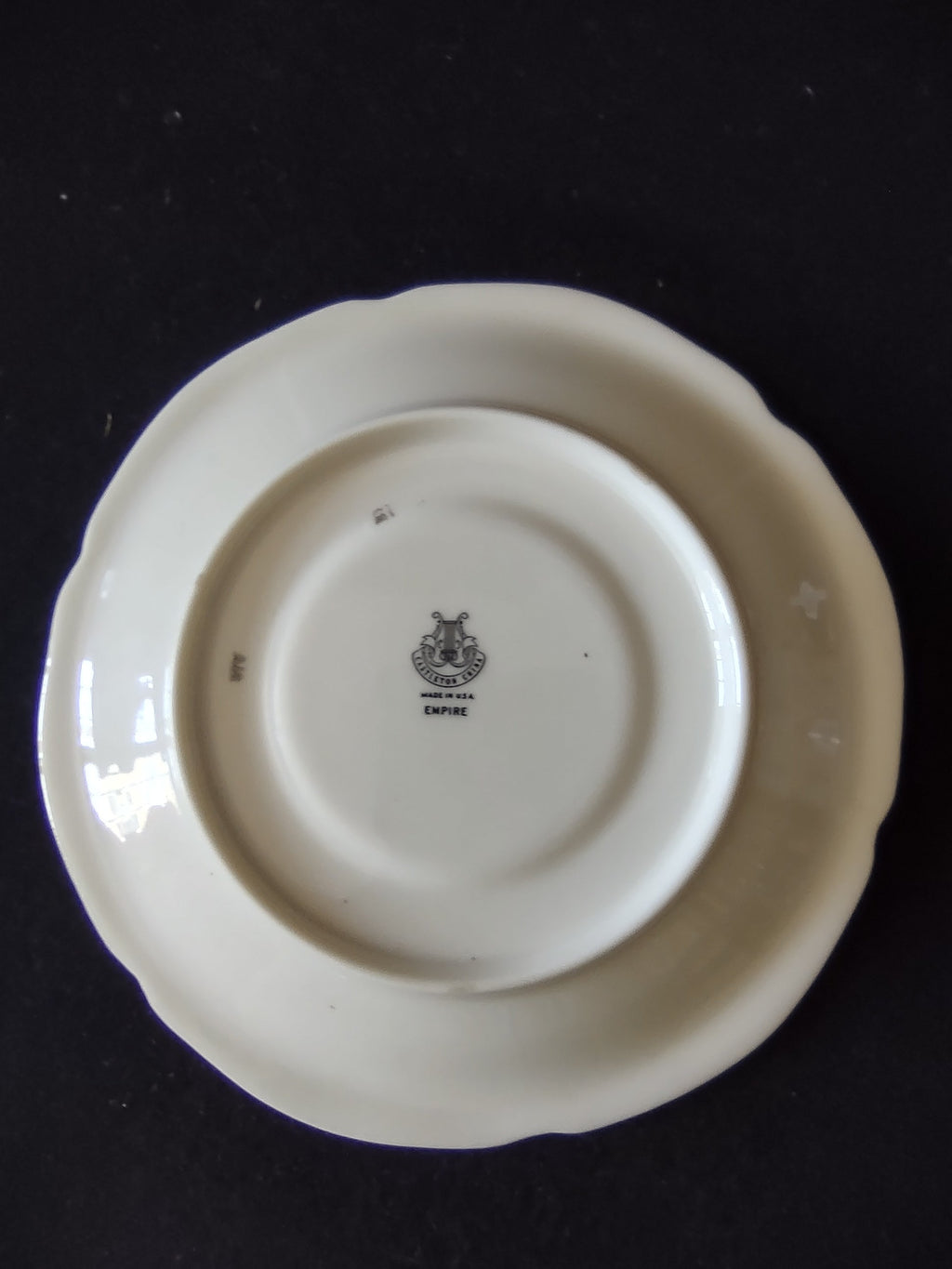 Castleton China Empire saucer front view on stand