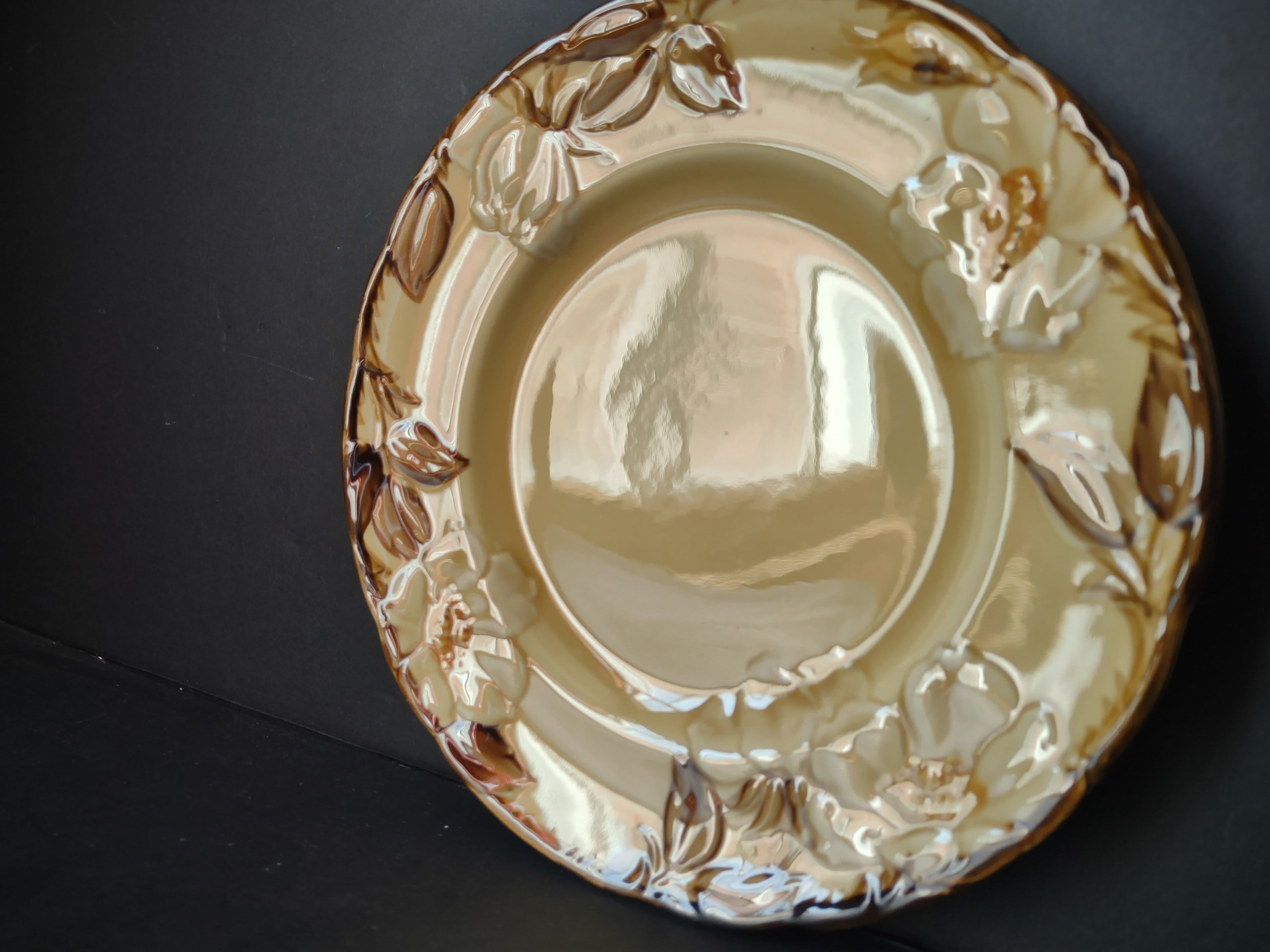 Vintage Franciscan Dinnerware embossed floral plate angled view showing sculptural relief detail