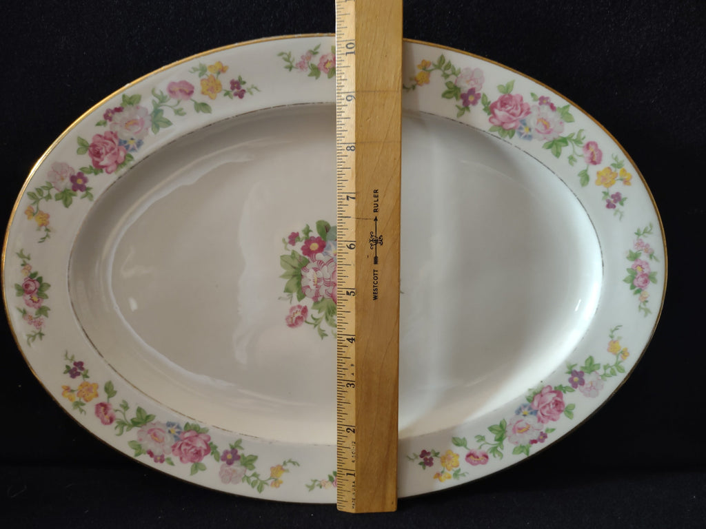 Vintage Lamberton China Dolly Madison oval serving platter front view, pink roses, yellow flowers, purple violets, gold trim border, approximately 12 inches wide