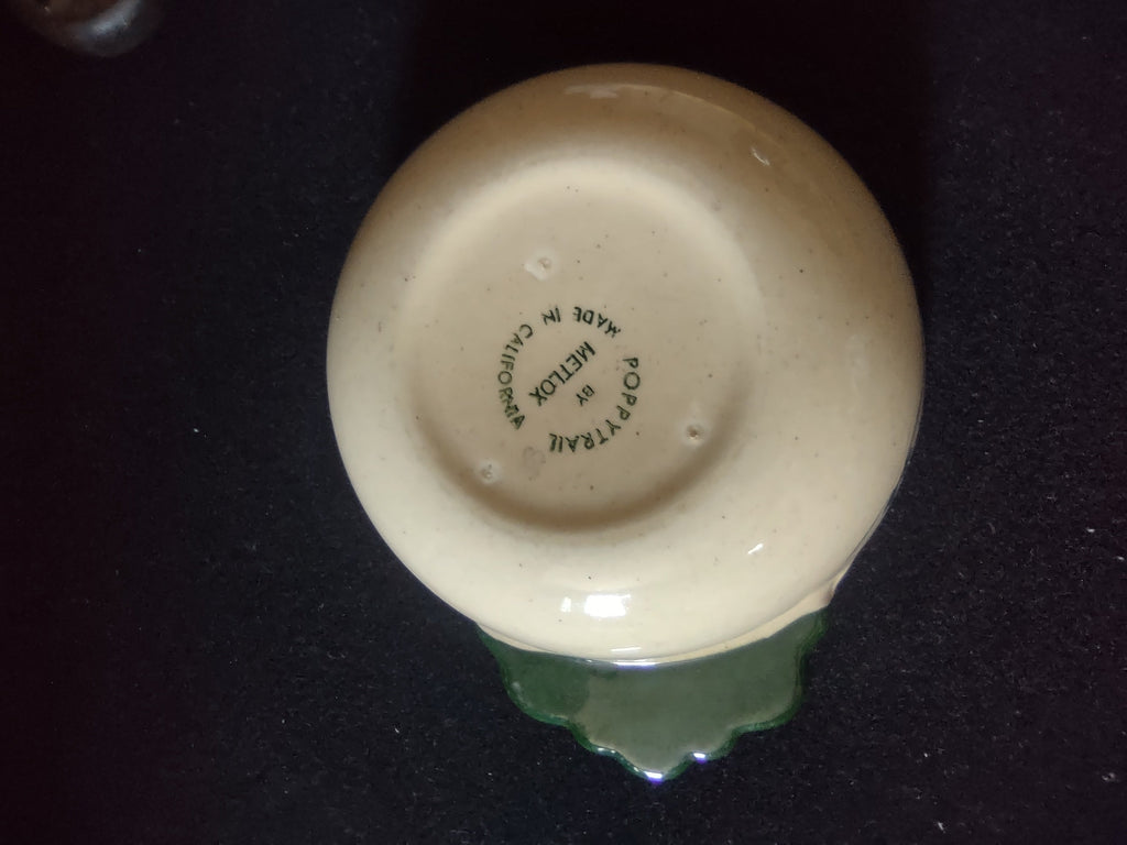 Close-up of Poppytrail by Metlox green backstamp