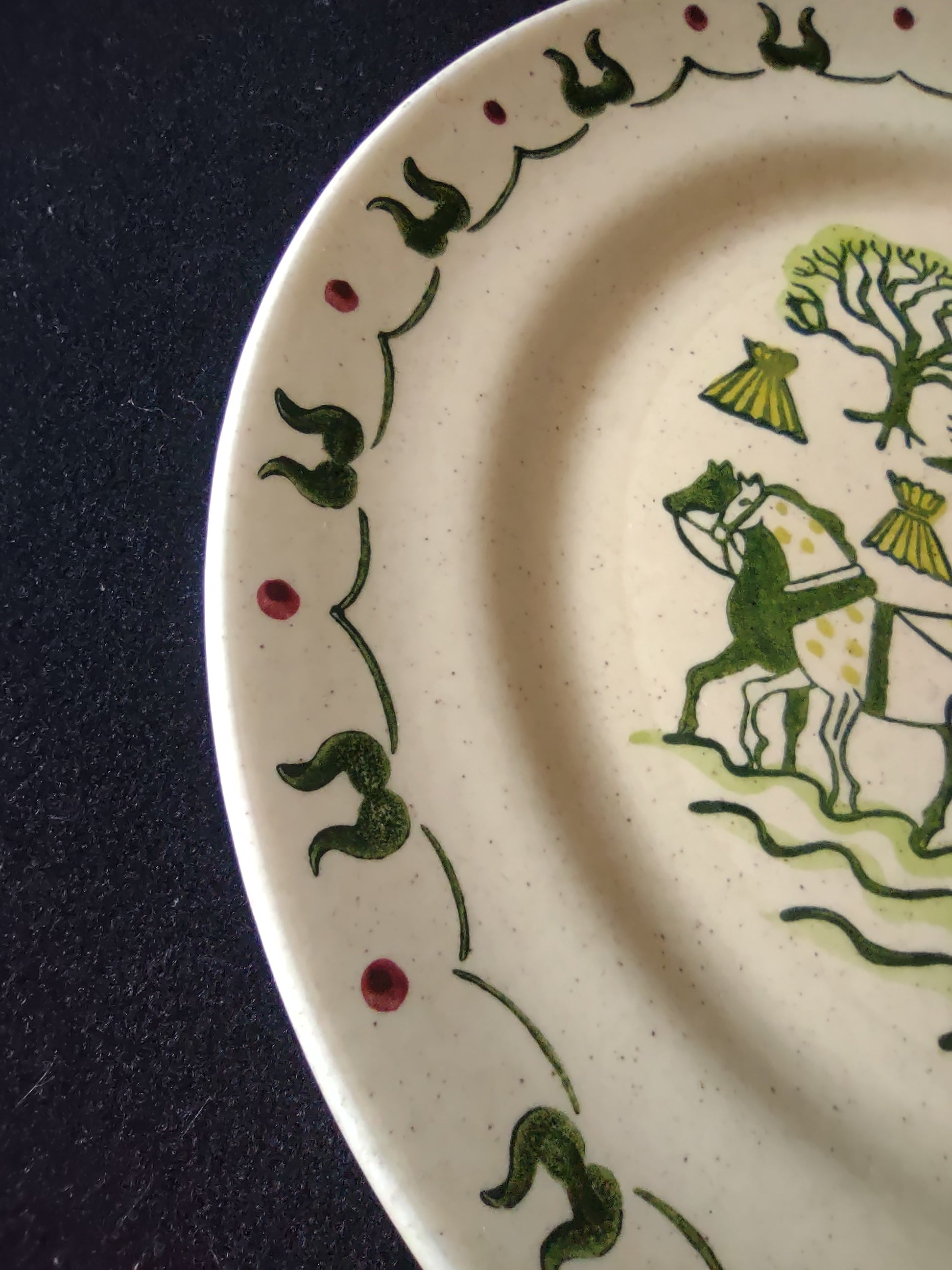 Close-up of center scene - farmer plowing with horses on Homestead Provincial plate