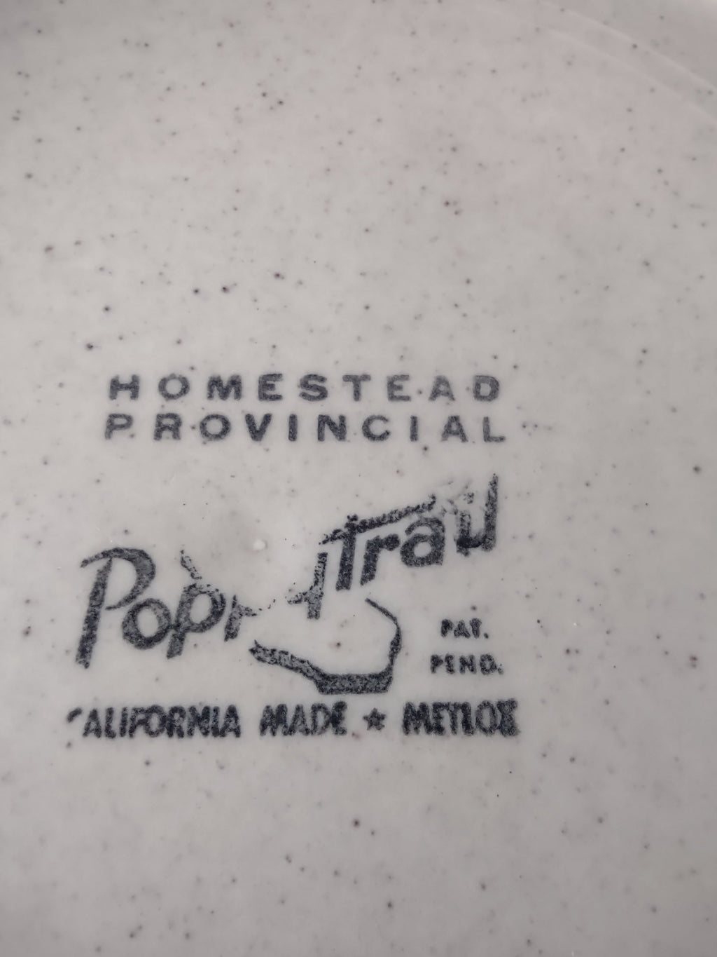 Vintage Metlox Poppytrail Homestead Provincial Plate with ruler showing approximately 9.5 inch diameter