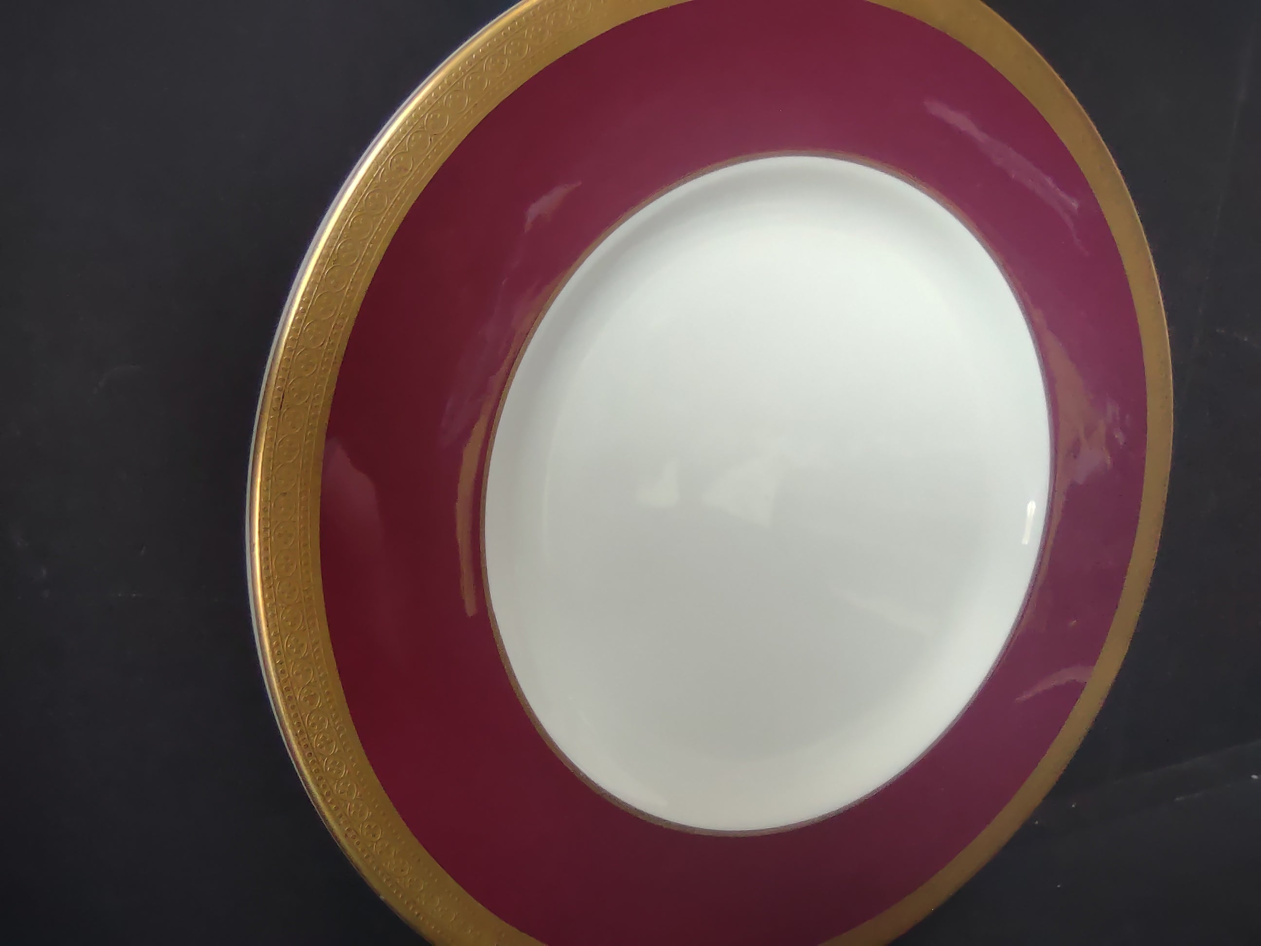 Syracuse China Crimson & Gold plate with ruler showing approximately 9.5 inch diameter