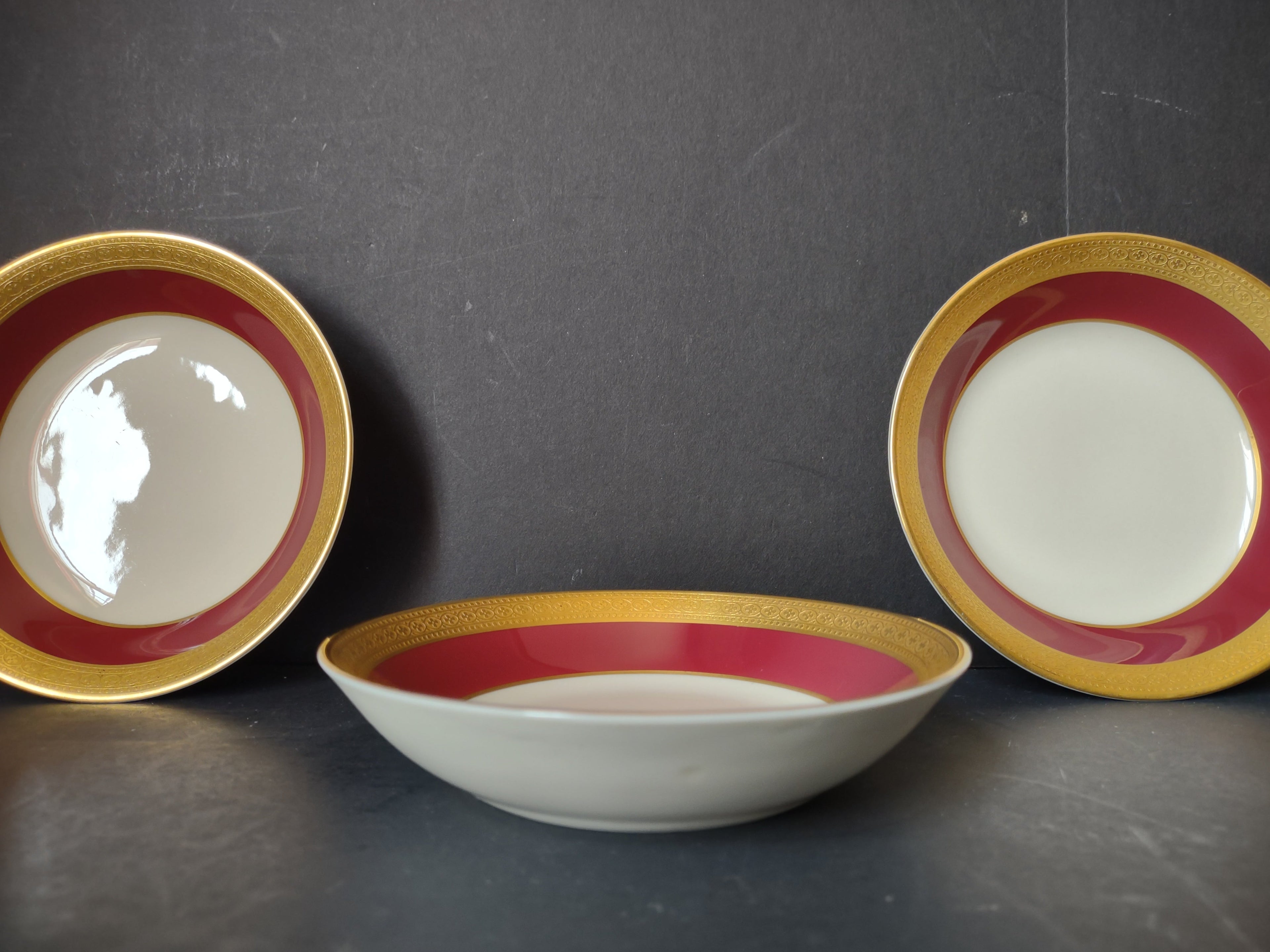 Vintage Syracuse China red gold plates set of 3 and bowl group display