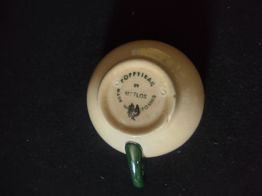 Metlox Poppytrail backstamp on base of Navajo cup - Made in California