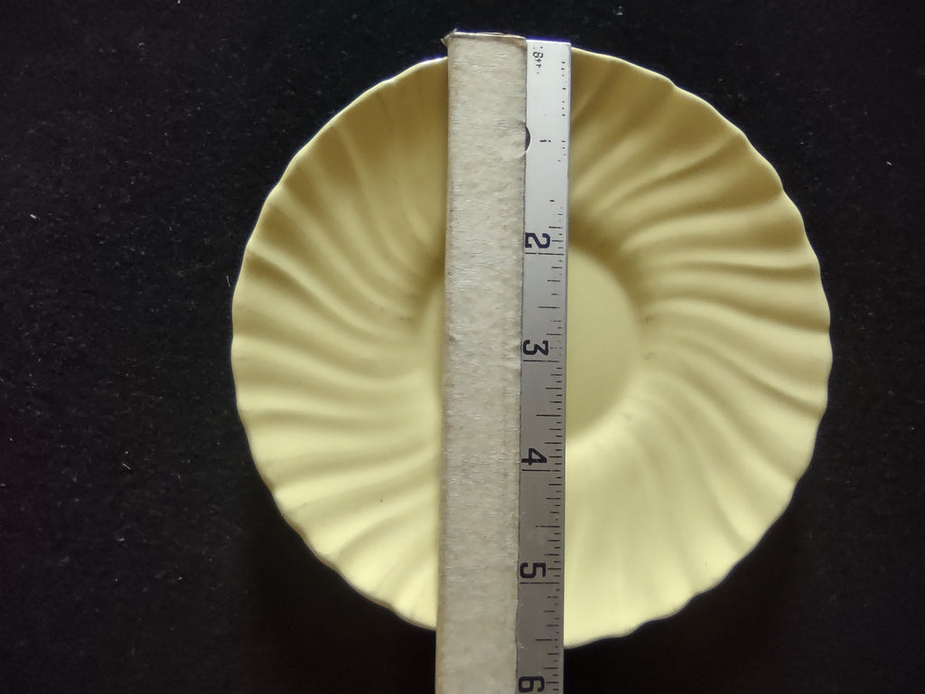 Close-up of Franciscan Ware Swirl yellow saucer interior detail